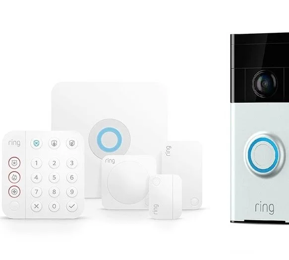 Collection of Ring home security devices including a keypad, motion sensors, contact sensors, and a video doorbell.