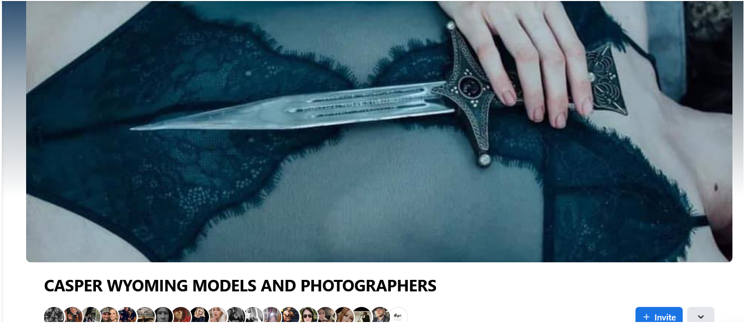 Sample photography by Alex Berardi-Hawley, featuring model SoPeachy, lying down with a dagger lain over her teal lace bodice.