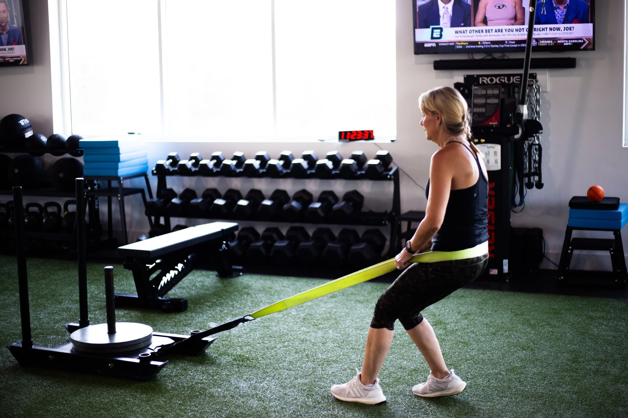 woman pulling weights