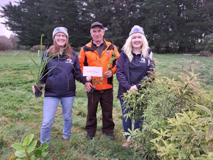 Planting native tree along the Styx River