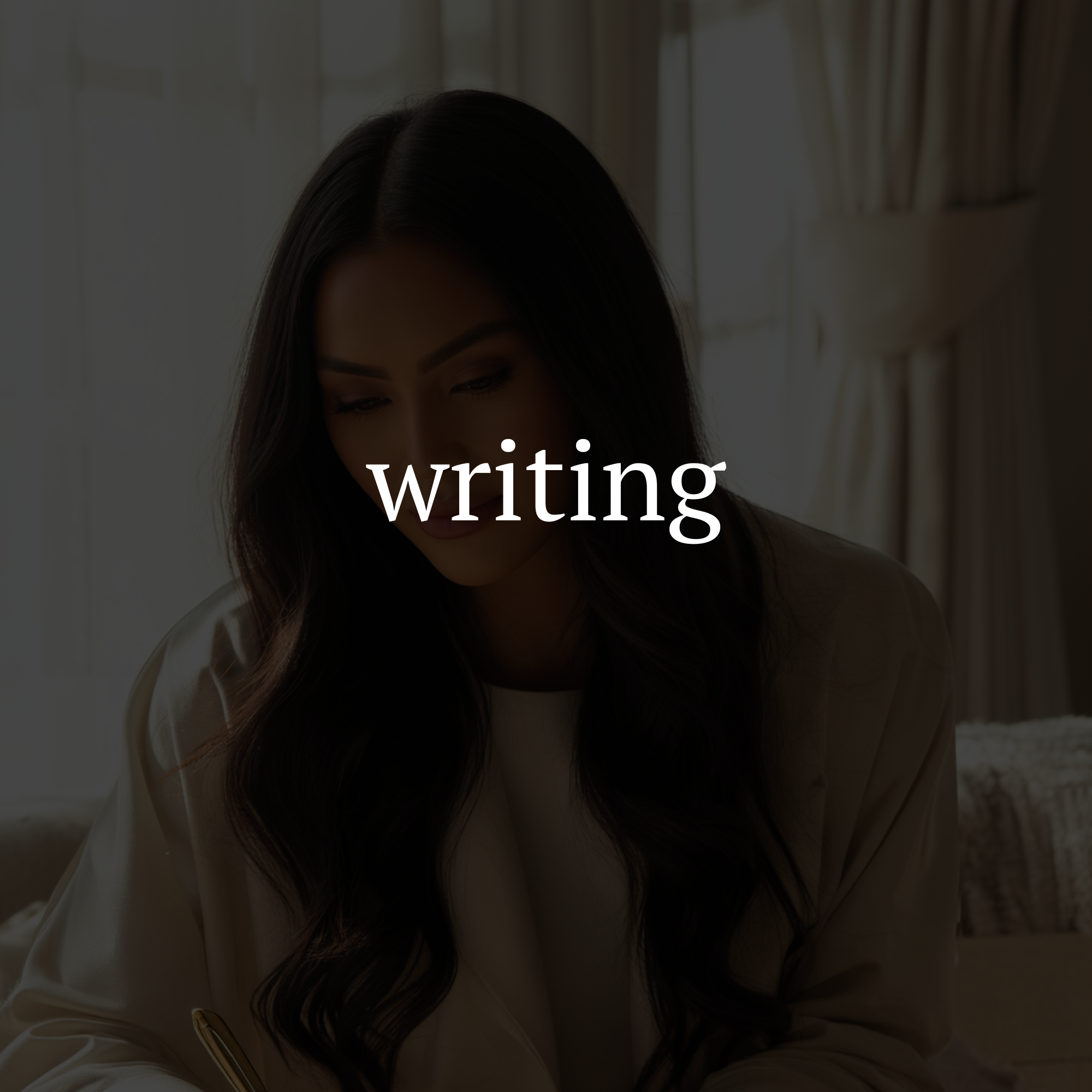 Shaykayla Smith writing at a desk in a well-lit room.