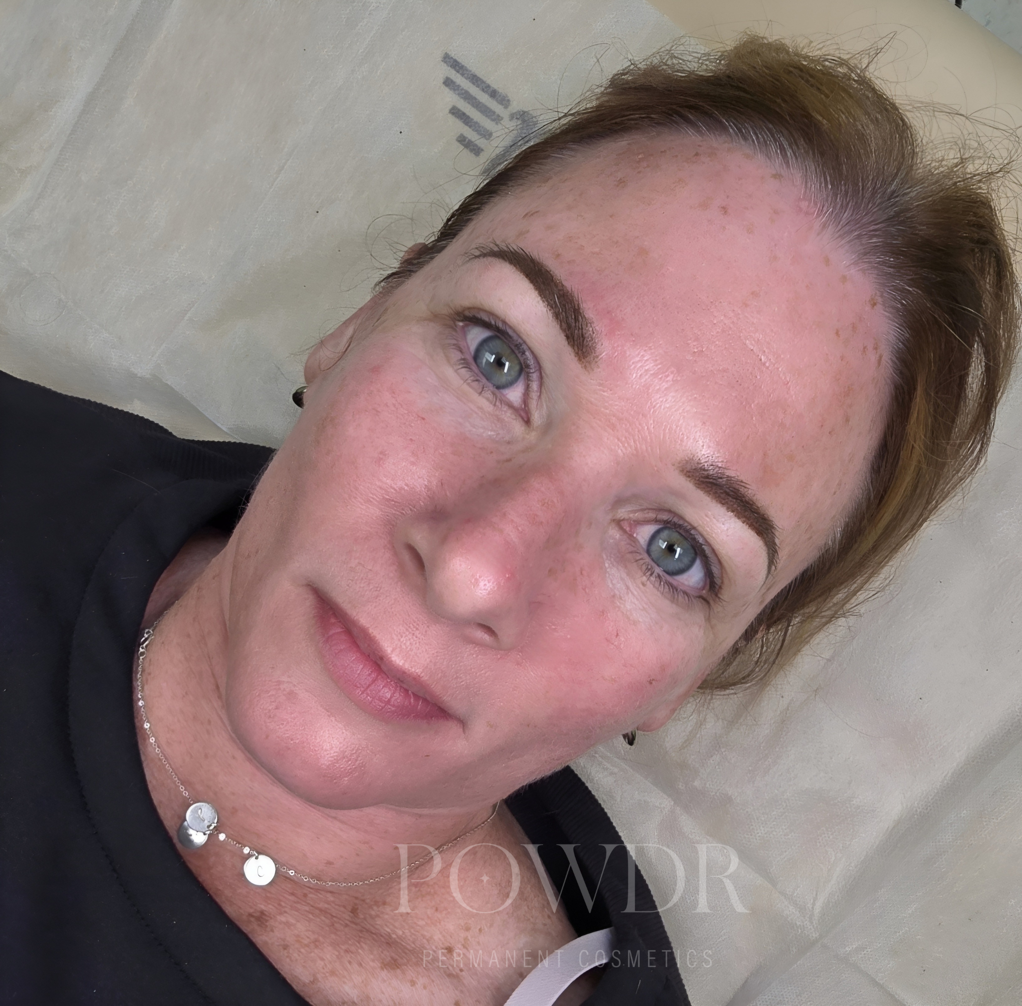 Dark brunette permanent eyebrows using a powder brows technique. This will heal 40-50% lighter.
