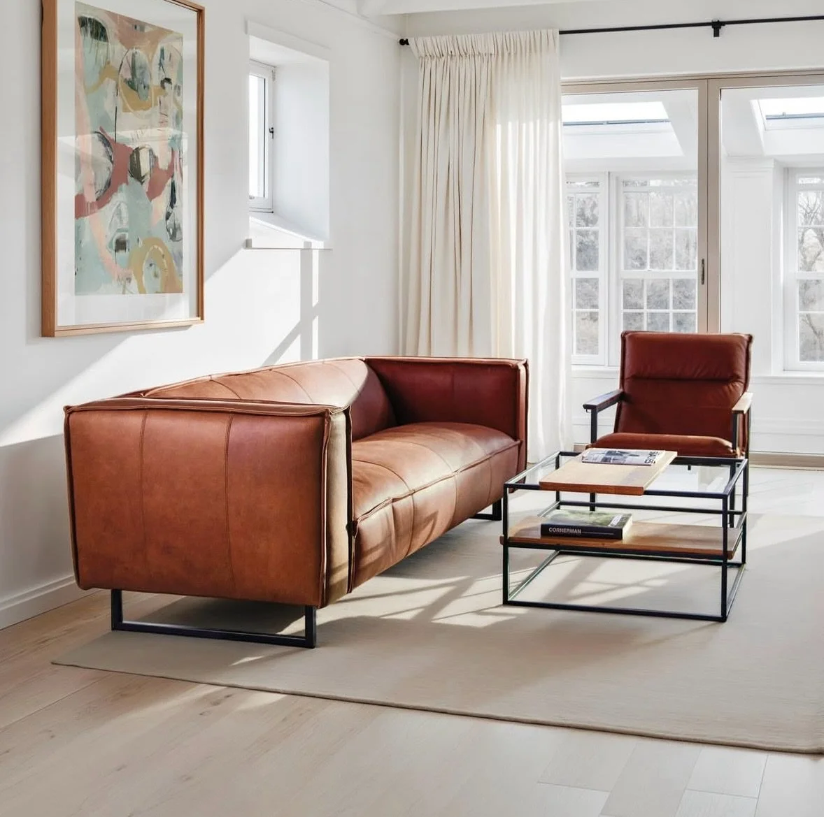 From Darcy and Duke 🪡 The stitched edge upholstery detailing compliments the structured contemporary shape. The real leather in cognac is soft and supple, and the sofa sits elegantly on framed supportive black metal legs. If you&rsquo;re looking for