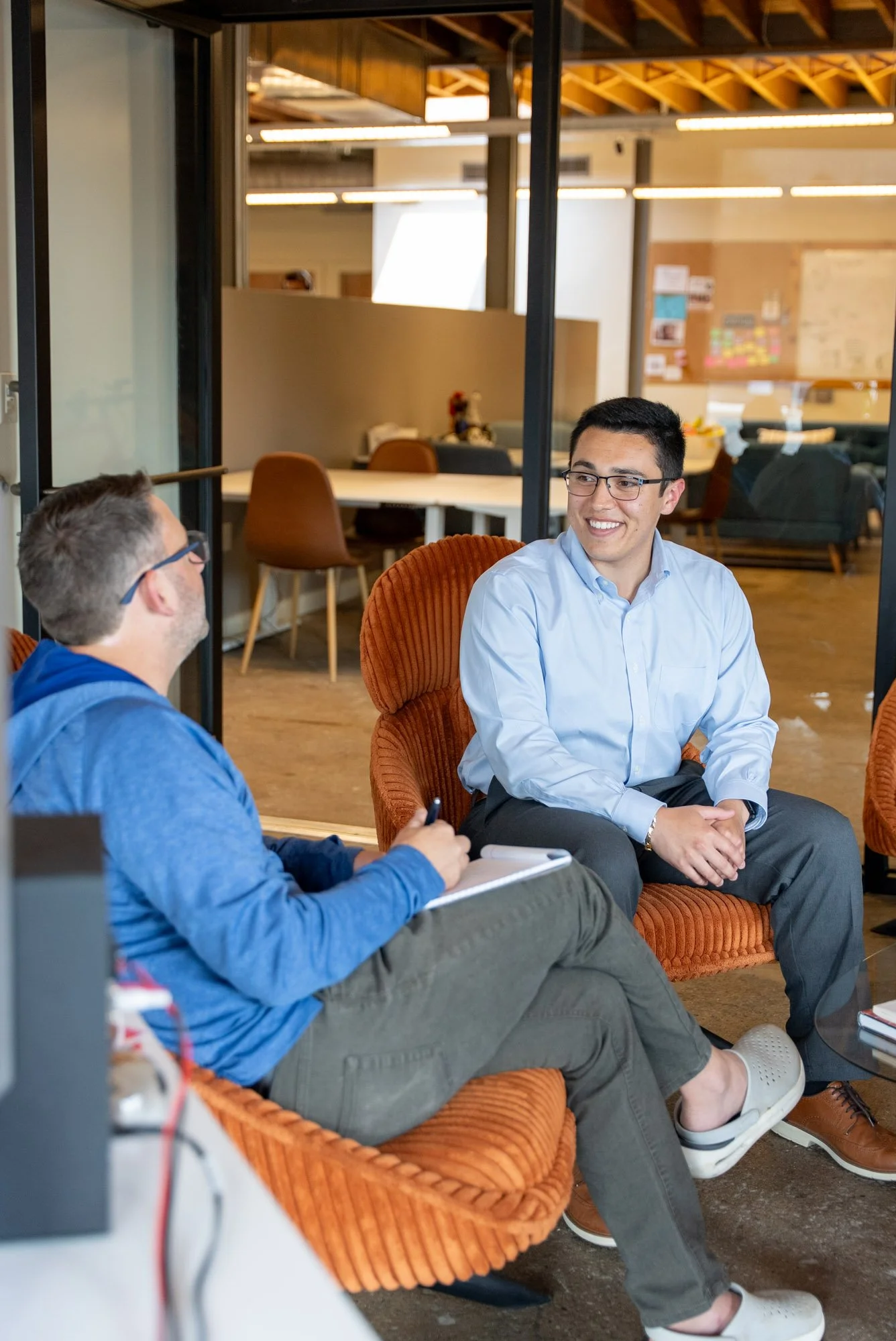 Fraud prevention professionals discussing risk and controls during an office consultation.