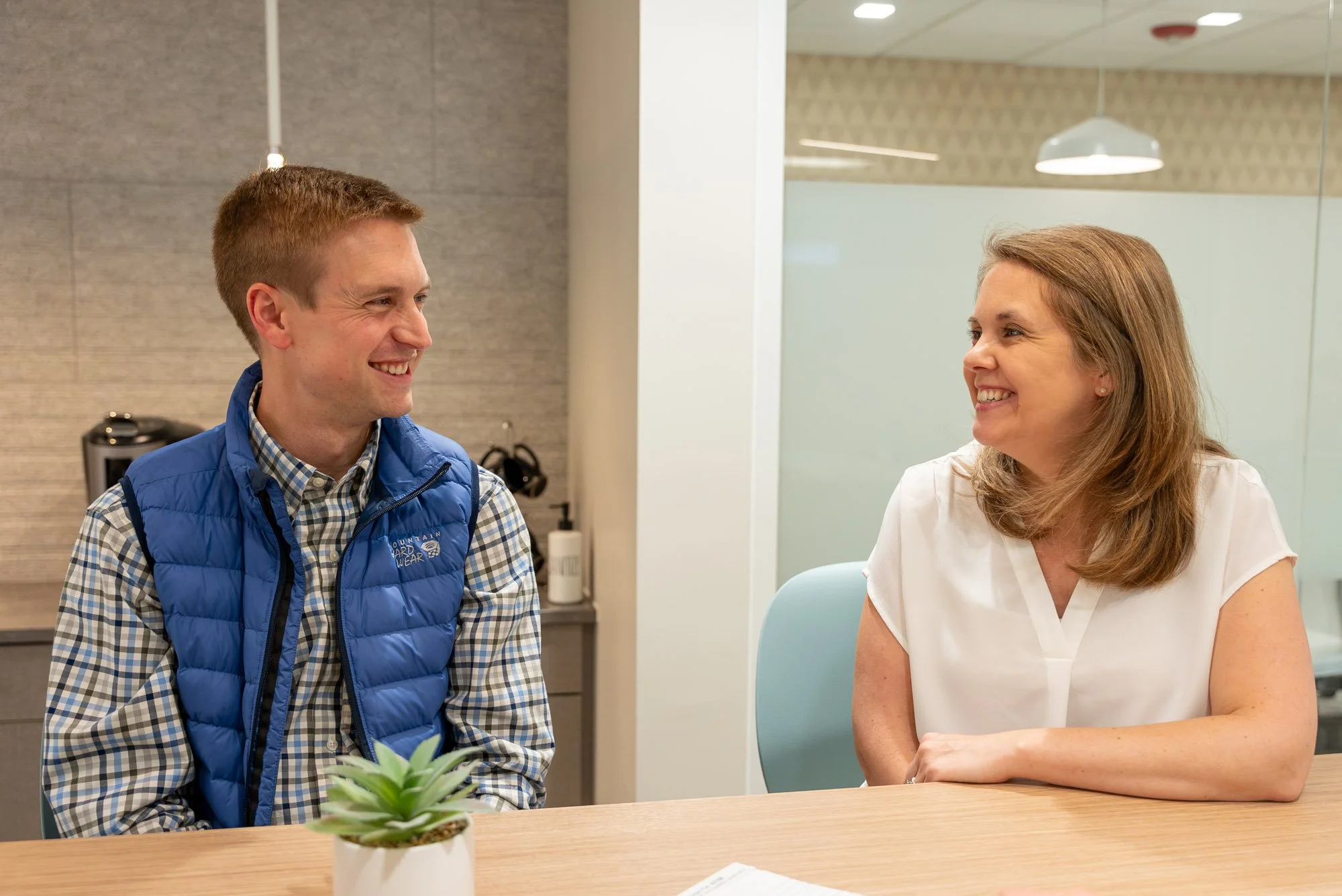 Trust and estate planning advisors meeting with a client to discuss long-term planning.