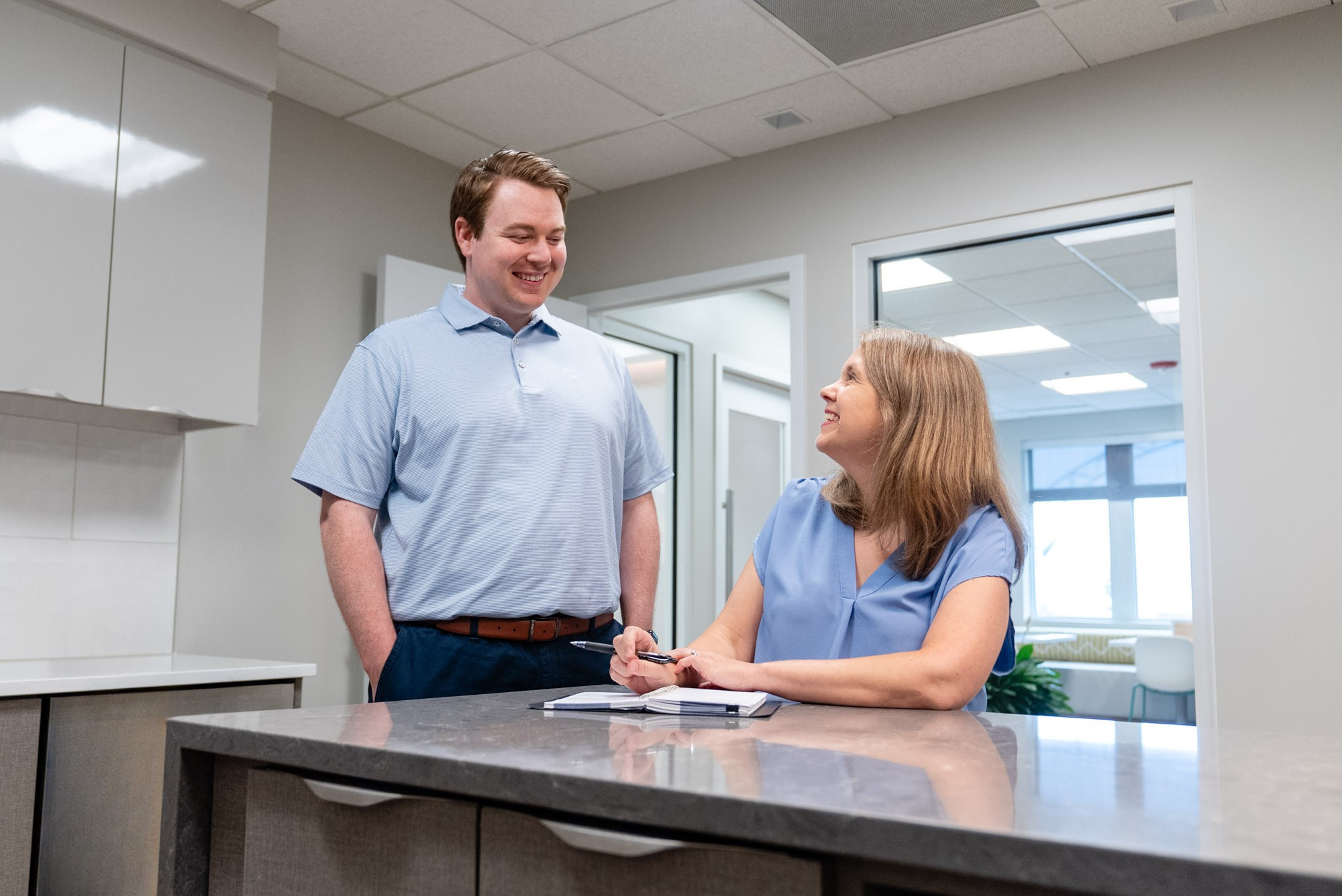 Accounting advisory professionals meeting in a modern office to discuss client financial strategy and business advisory services.