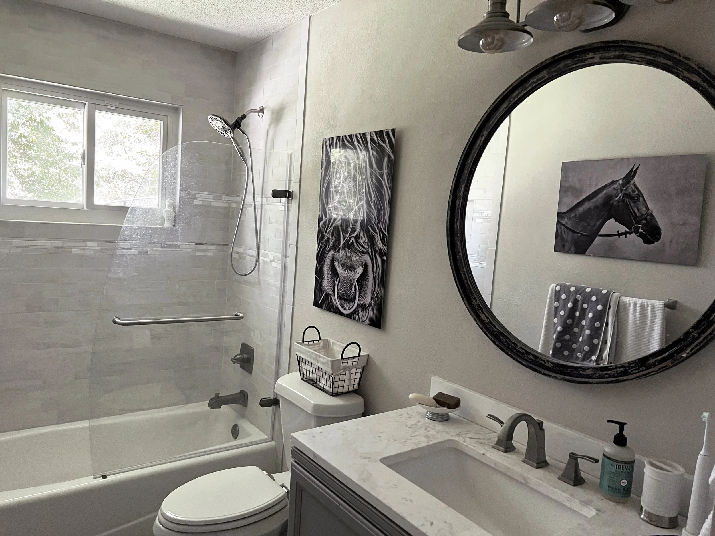This was a complete strip-down, deliberately rebuilt using concrete and stone materials plus paint tones that impart a soothing, cool feel to offset Arkansas summer heat and humidity. A visual cooling cave. Conversely, amber-toned Edison bulbs in t