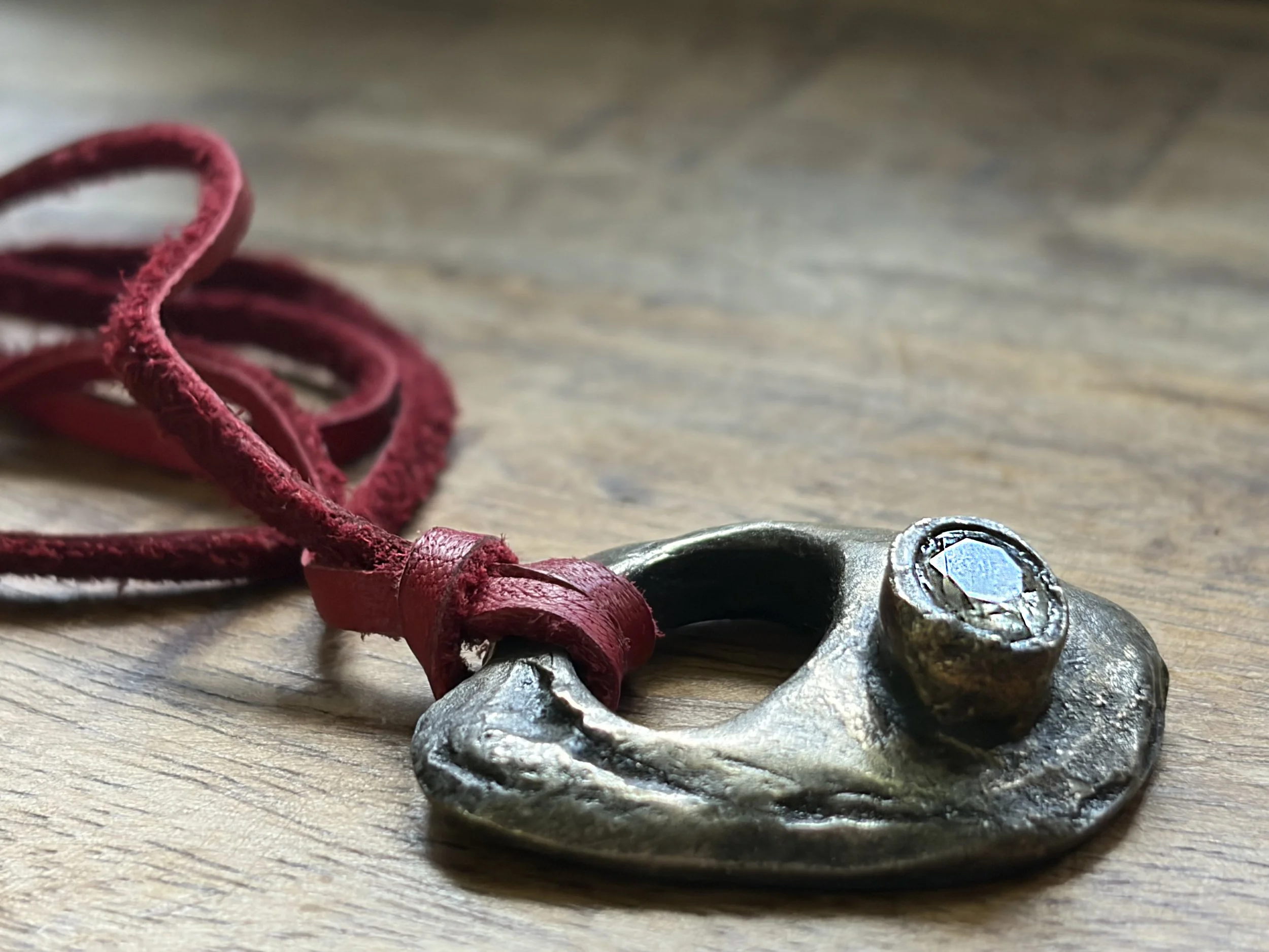abstract-necklace-bronze-leather-red-gemstone-side-view-birdley-studio.jpg