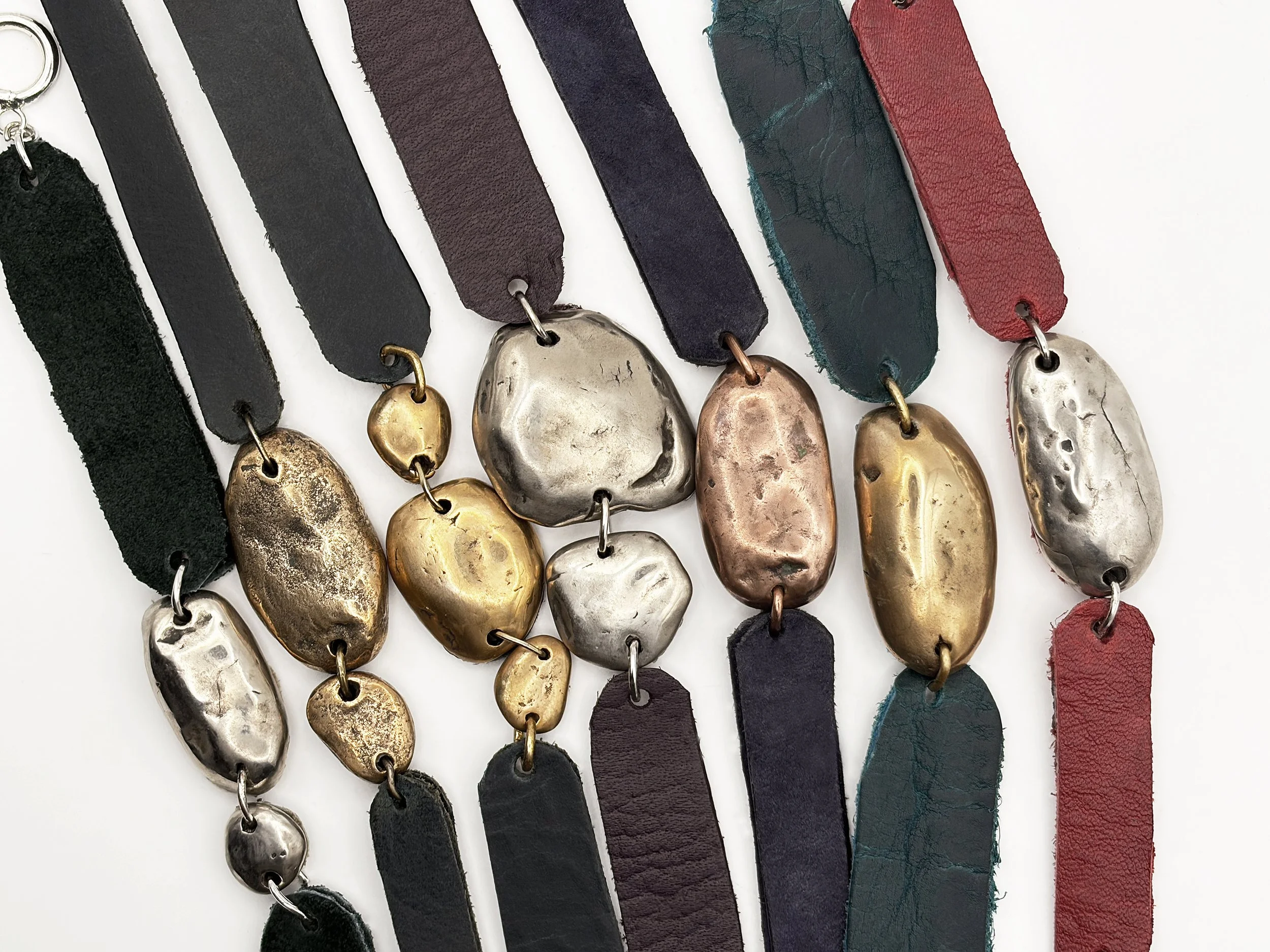 Bracelet: Harmony Collection Polished River Stones in Bronze, Copper and White Copper on Leather