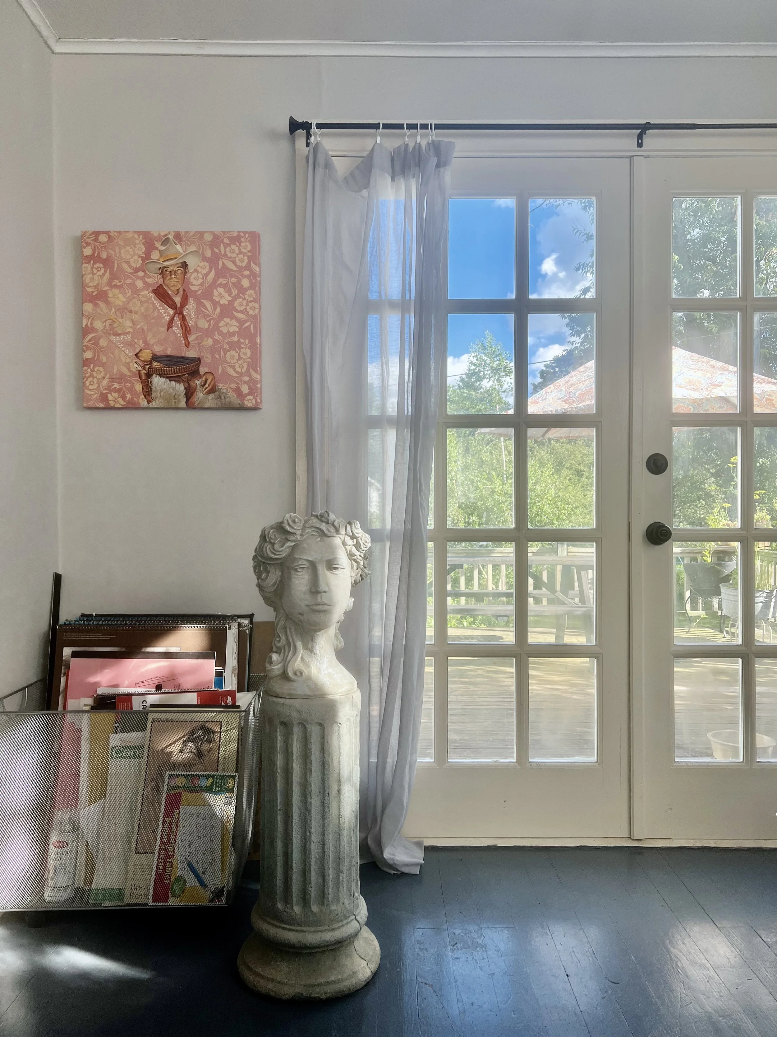 Floors in selected areas of the house are painted grey and lift the light levels beautifully. This blue-grey gloss finish transitions you right outside onto the porch.