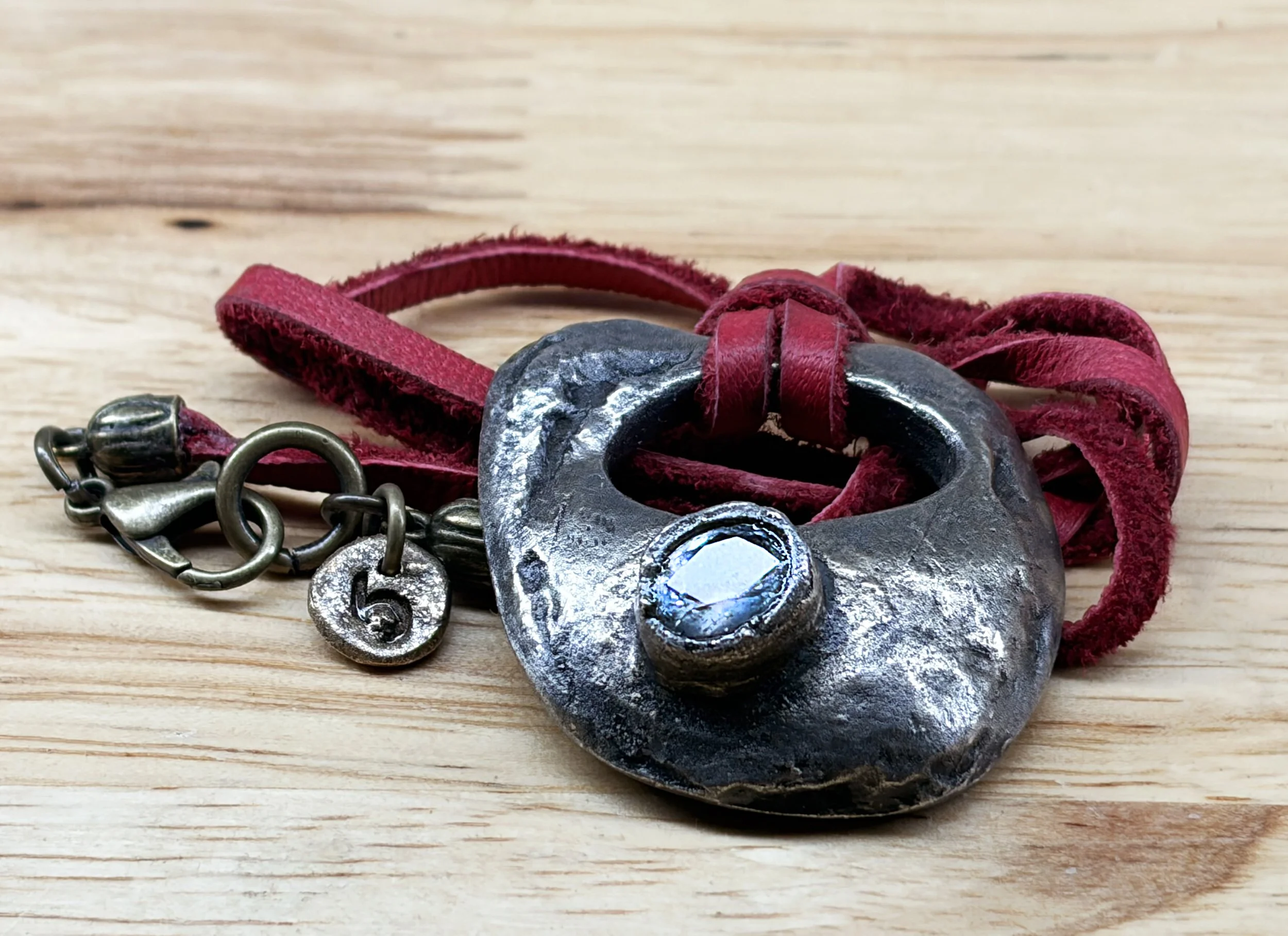 abstract-necklace-bronze-red-leather-white-gemstone-overhead-birdley-studio.jpg
