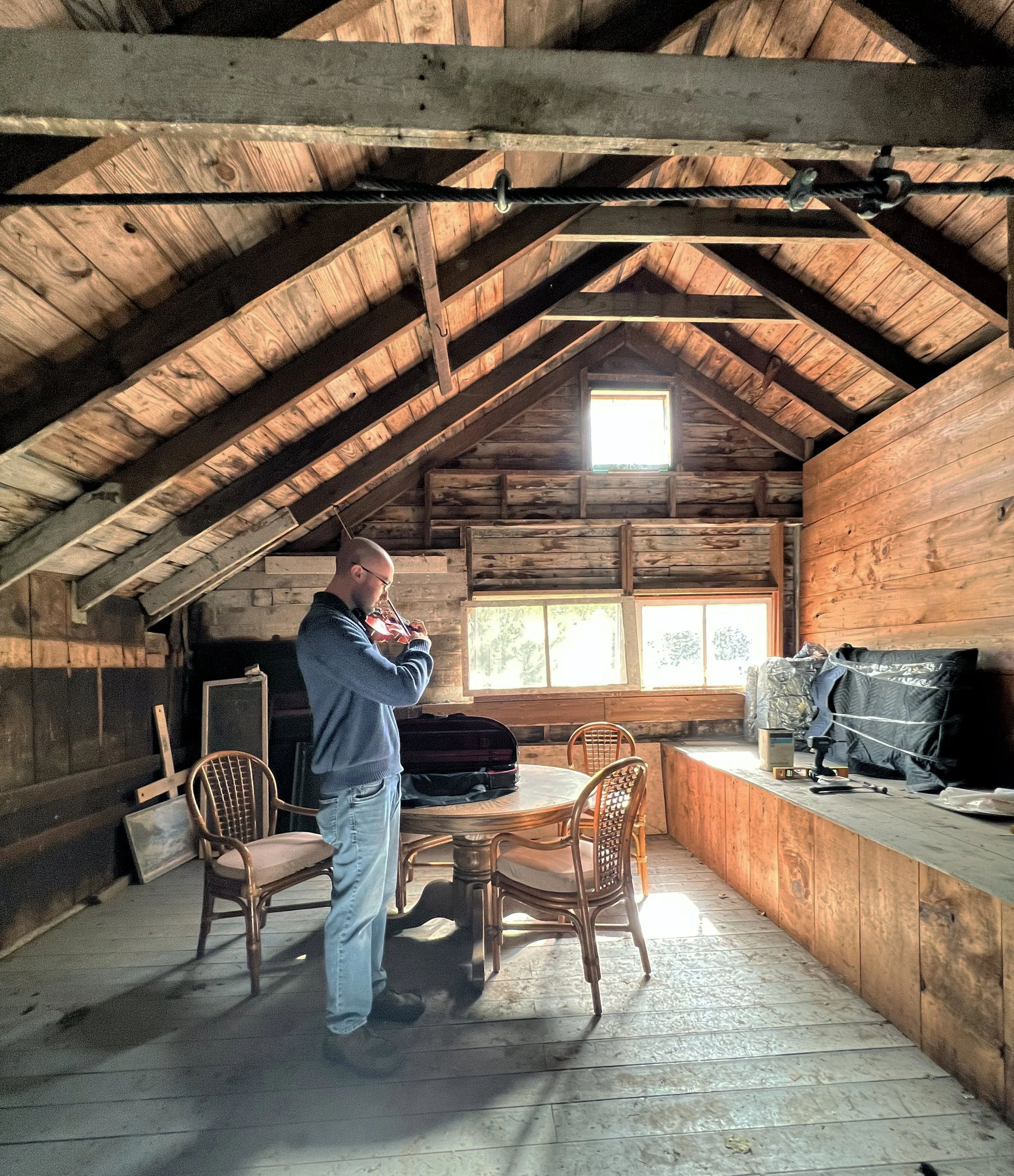A violin virtuoso practicing in the barn studio, 3rd floor. Artisan Hill Farm & Studio is his chosen destination for quiet rehearsal time.