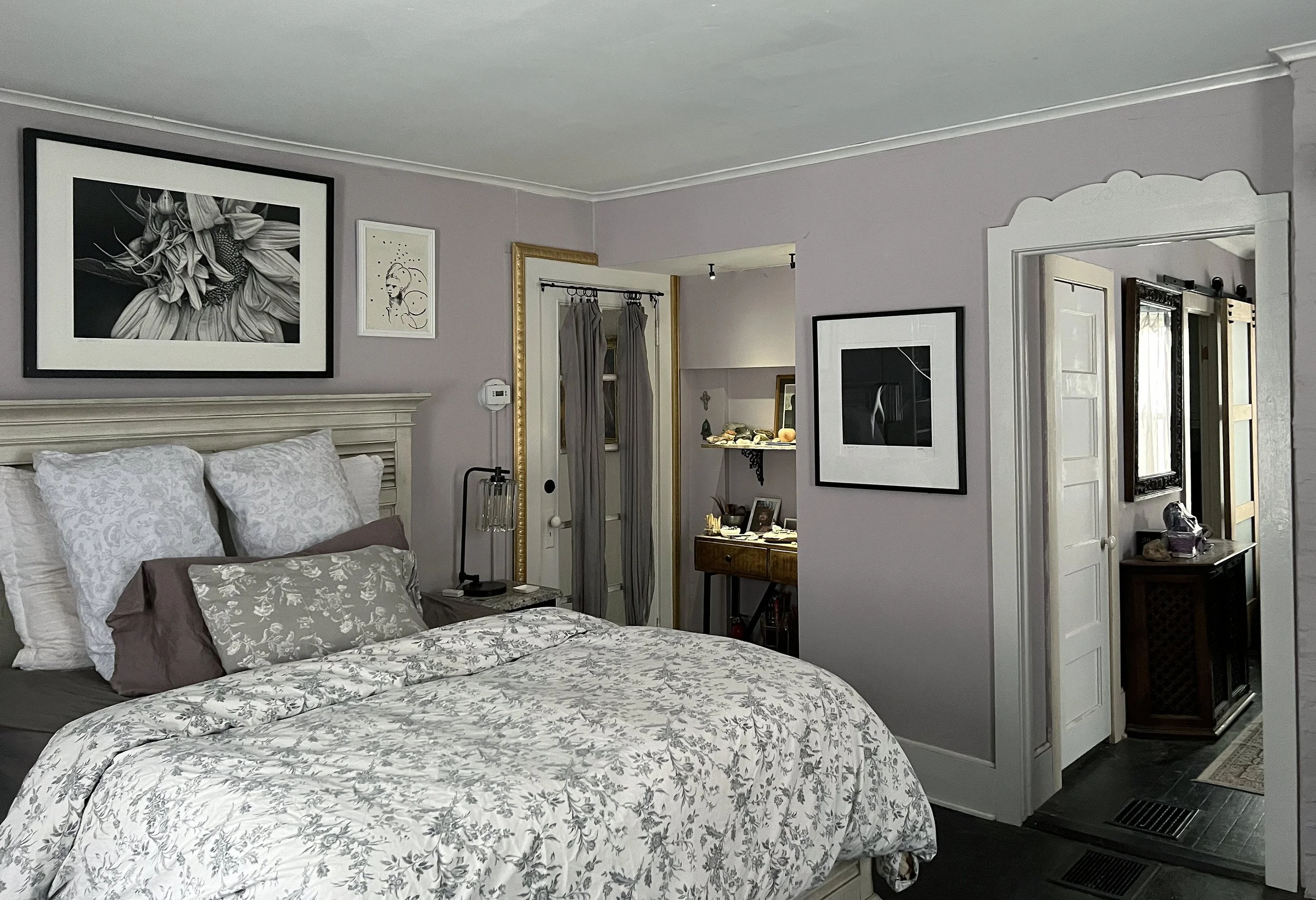 This broader view of the completed Owner's Suite shows the passageway into the dressing room, and a sliver of the beautiful frosted glass paneled barn door into the bathroom. There was no natural light in the tiny bathroom and it felt suffocating.