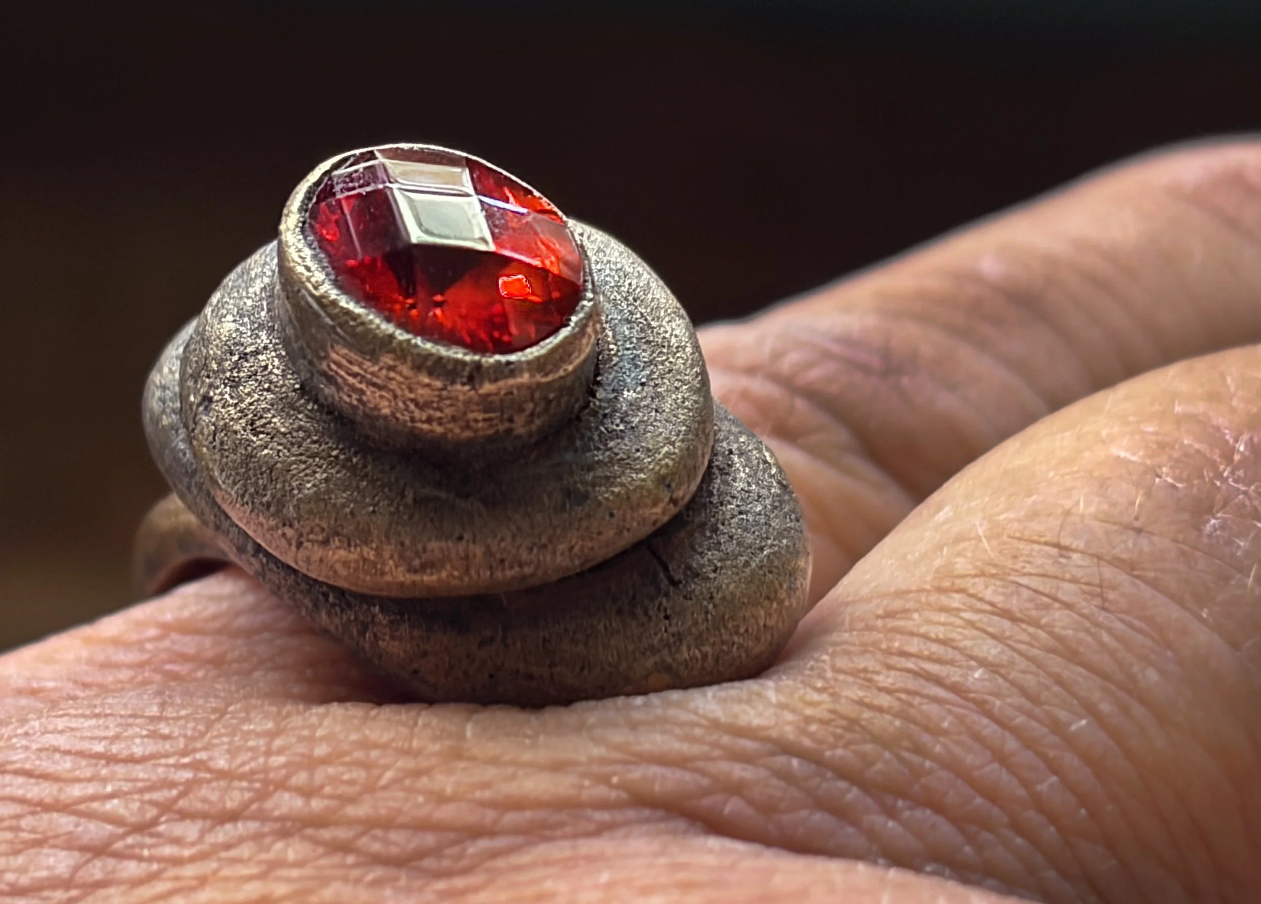 cairn-ring-harmony-collection-bronze-red-gemstone-worn-angled-birdley-studio.jpg