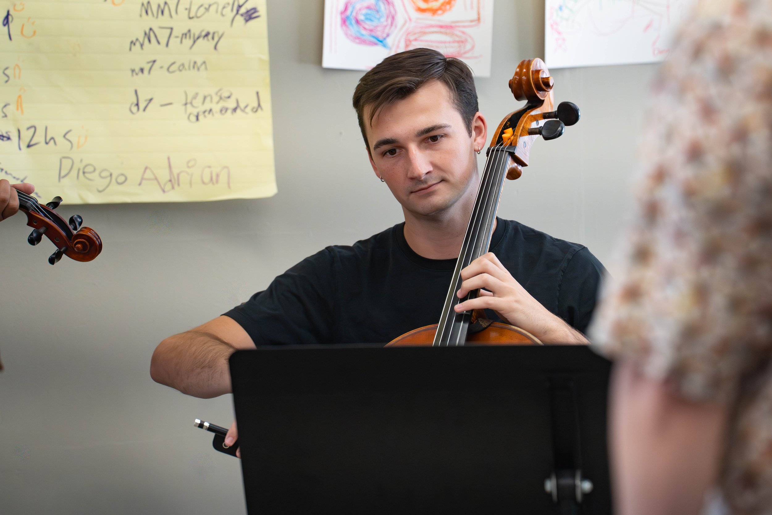 Peter reading a student composition at SCVYO Performer Composer Workshop