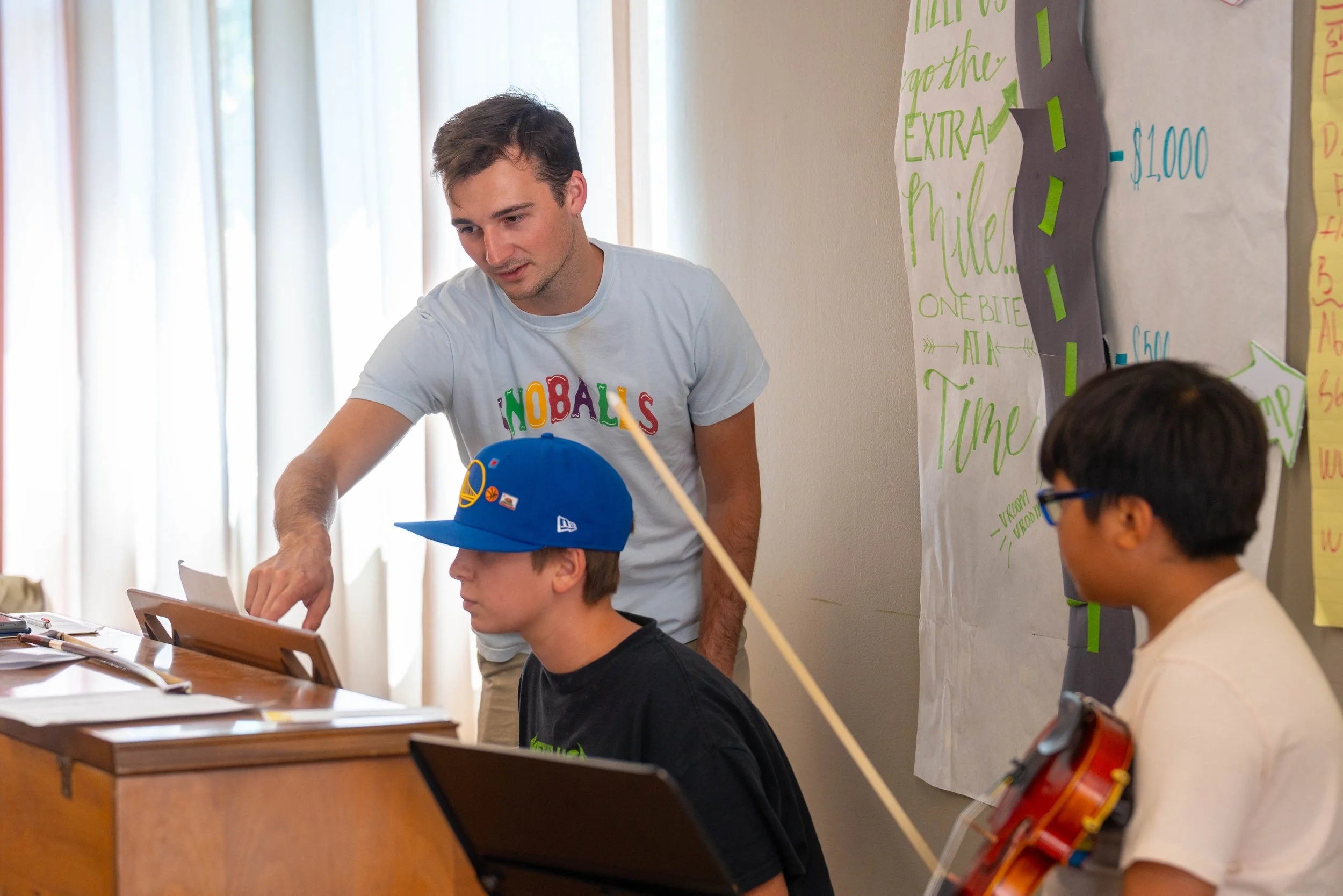 Peter Walsh helping a student rehearse an original composition at SCVYO Performer Composer Workshop