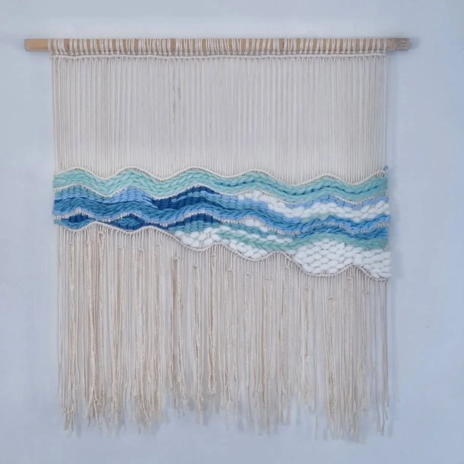Very inspired by the frothy waves at Layan beach near my home in Phuket. Made with an assortment of yarns collected over the years and a bamboo branch found at the side of the road.
π· Photos by @roulidiamond π
.
.
.
.
.
#weaving #textileart #fibrea