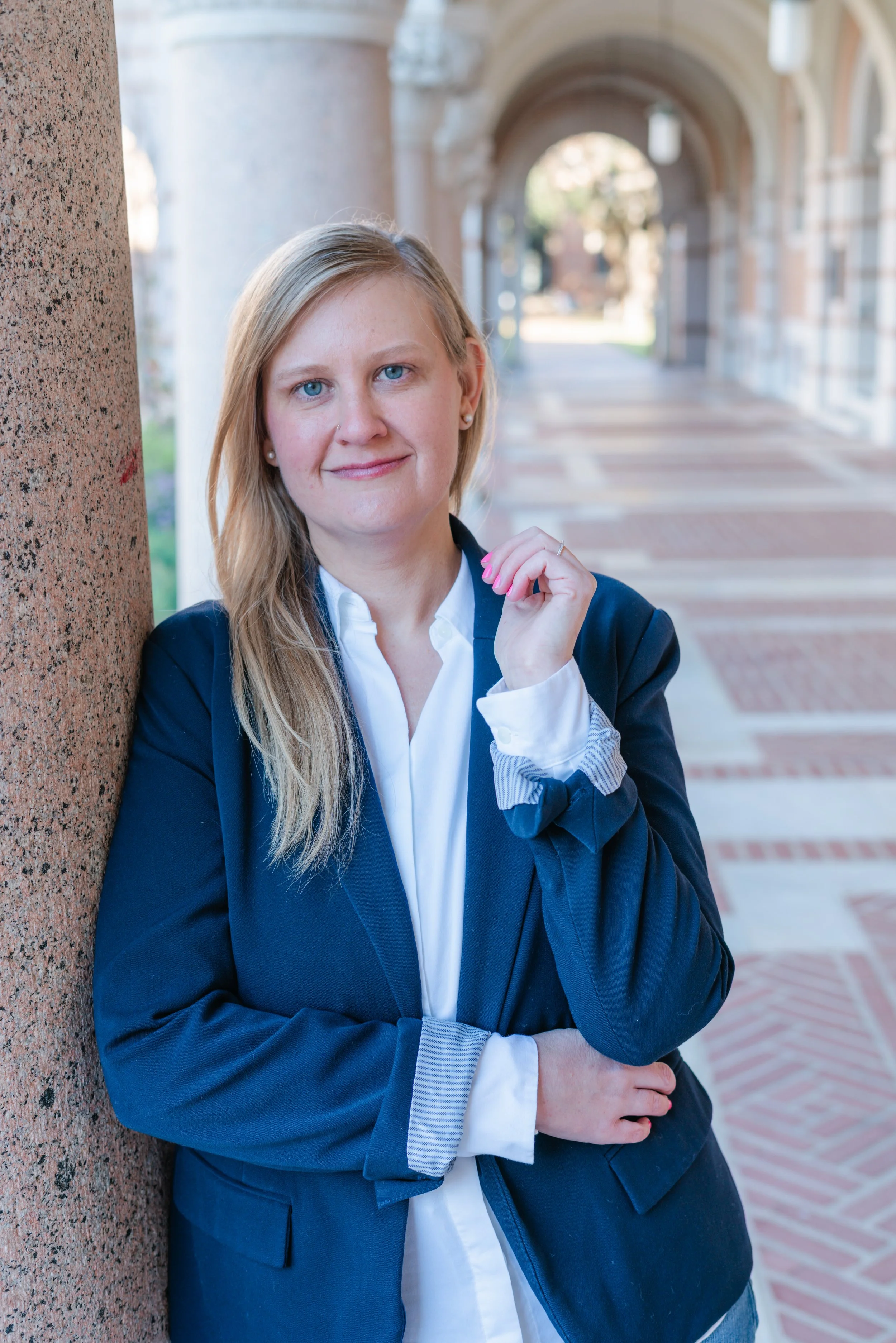 white blonde cis-gender woman smiling