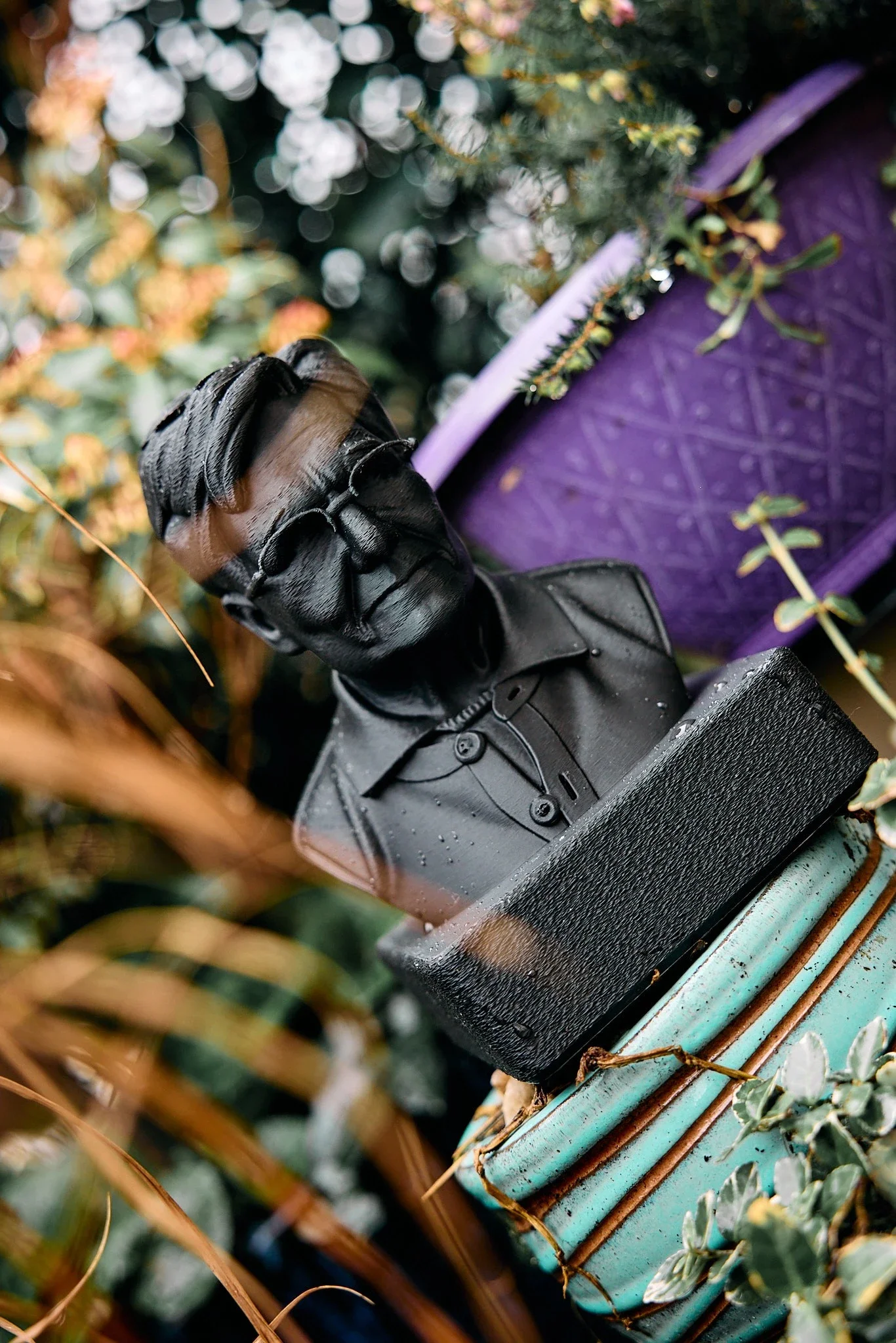 A custom 3D-printed figurine featuring intricate detail and a smooth black finish, showcasing bespoke manufacturing options for unique niche physical products for businesses in the EU..