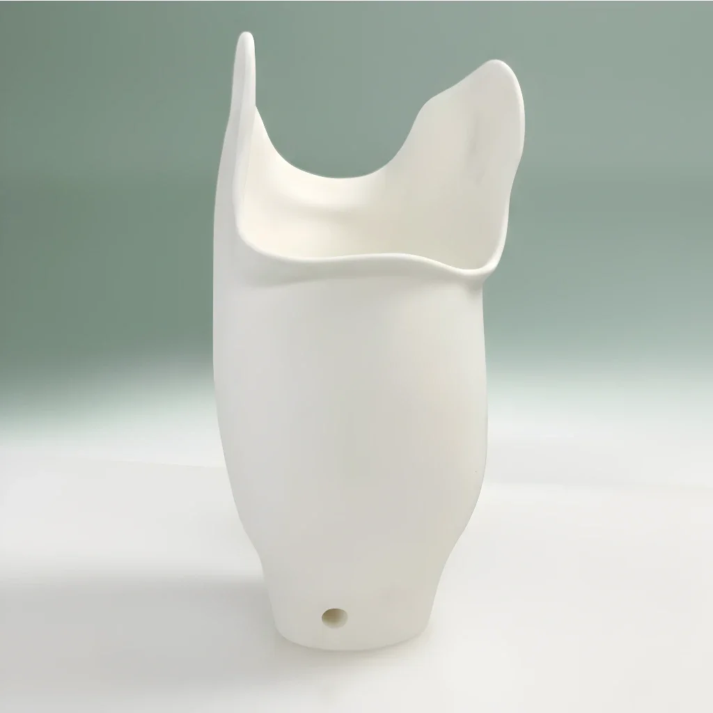 White 3D printed industrial component prototype, illustrating WAZP precision engineering and additive manufacturing