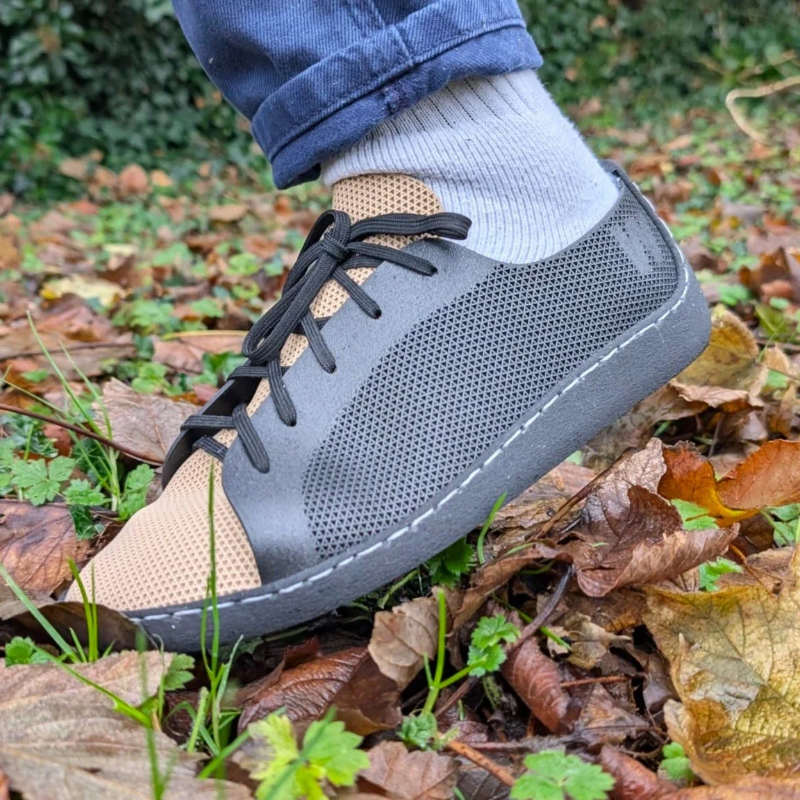 Anatomical fit 3D printed footwear being worn outdoors, demonstrating market-ready design for everyday use, made on demand for individual feet parameters.