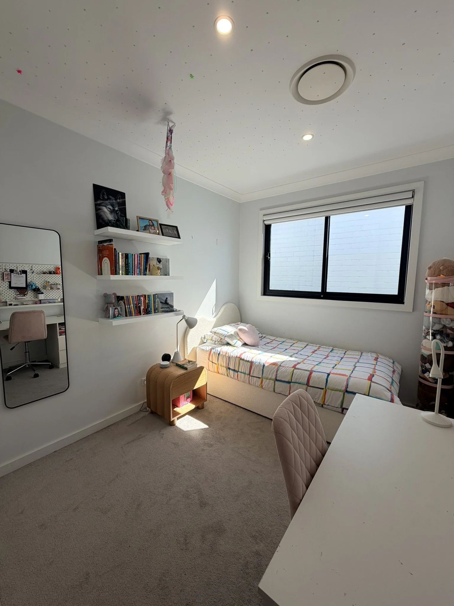 Organised girls bedroom after