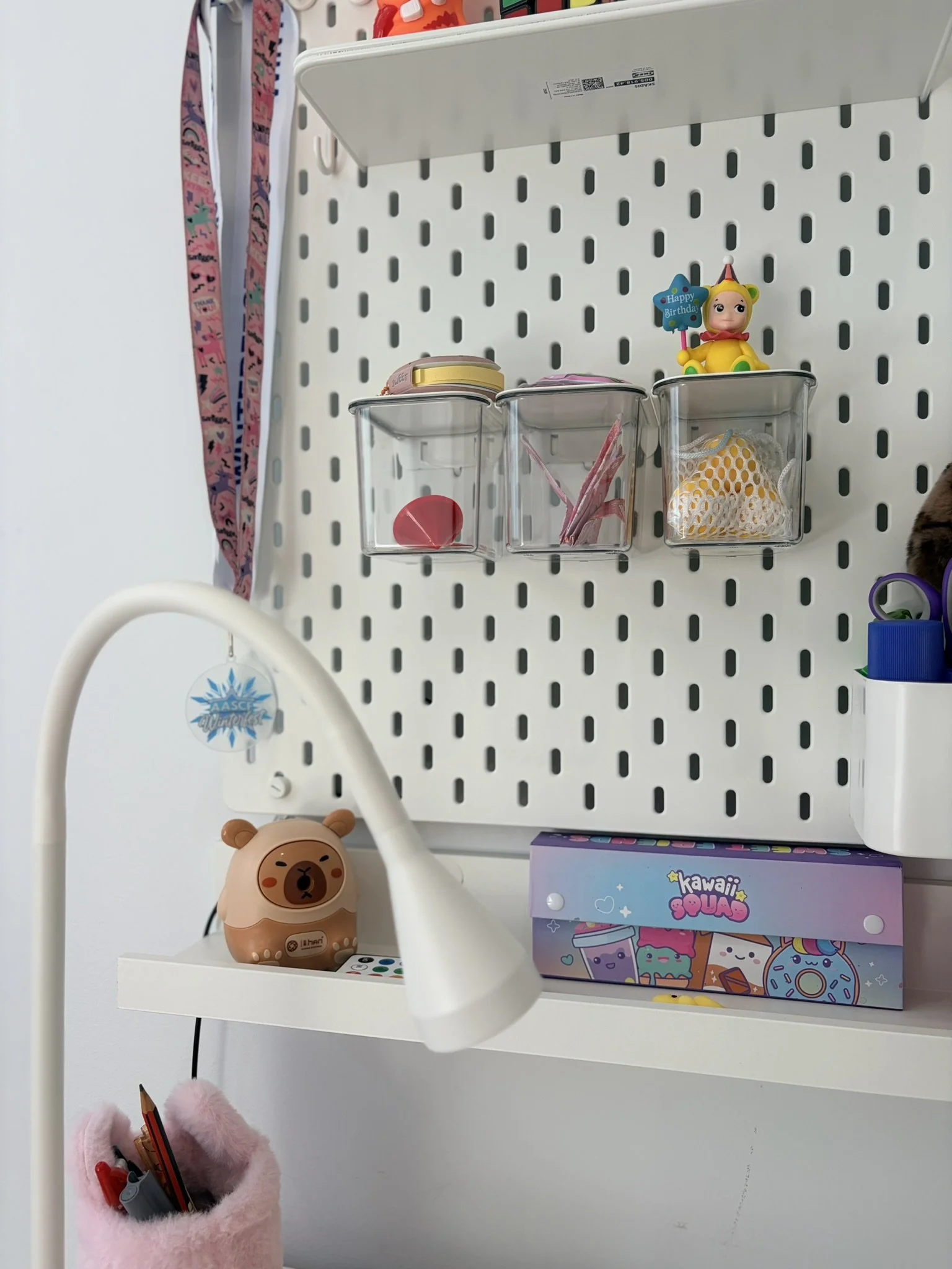 A timber bunk bed in a tidy and organised children's Bedroom with lots of storage compartments for the toys.