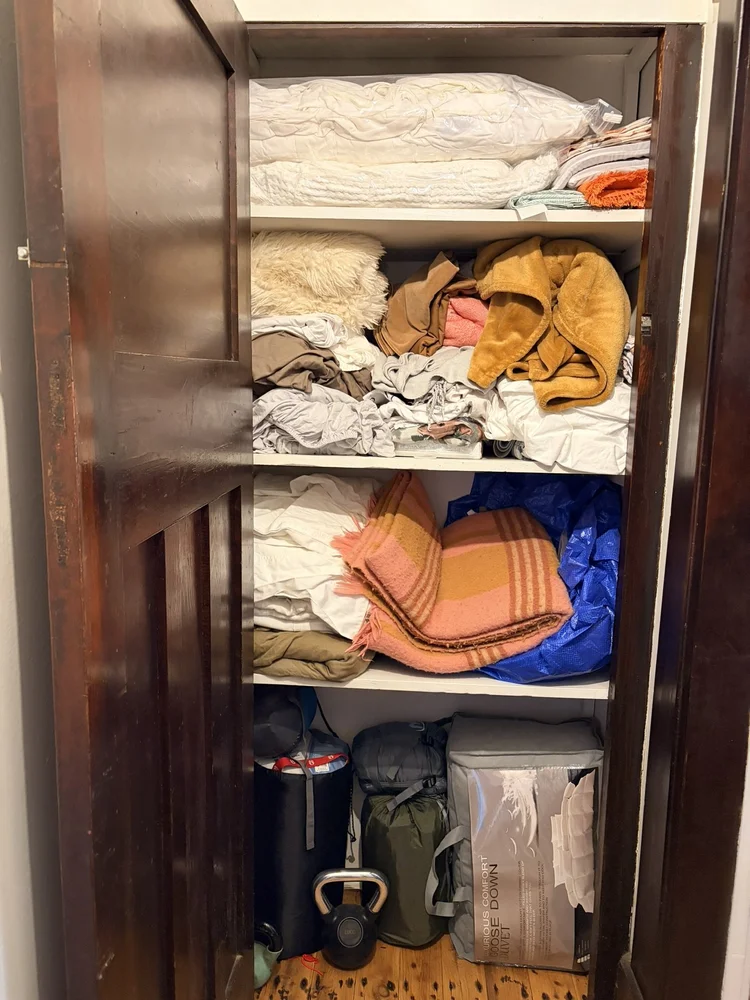 Linen cupboard before