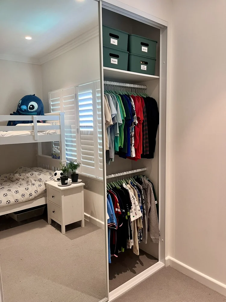 Organised boys wardrobe after