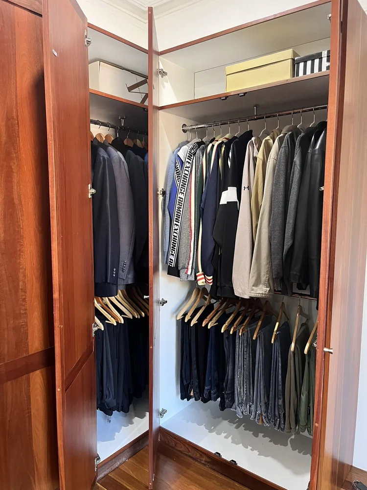 Organised male wardrobe after