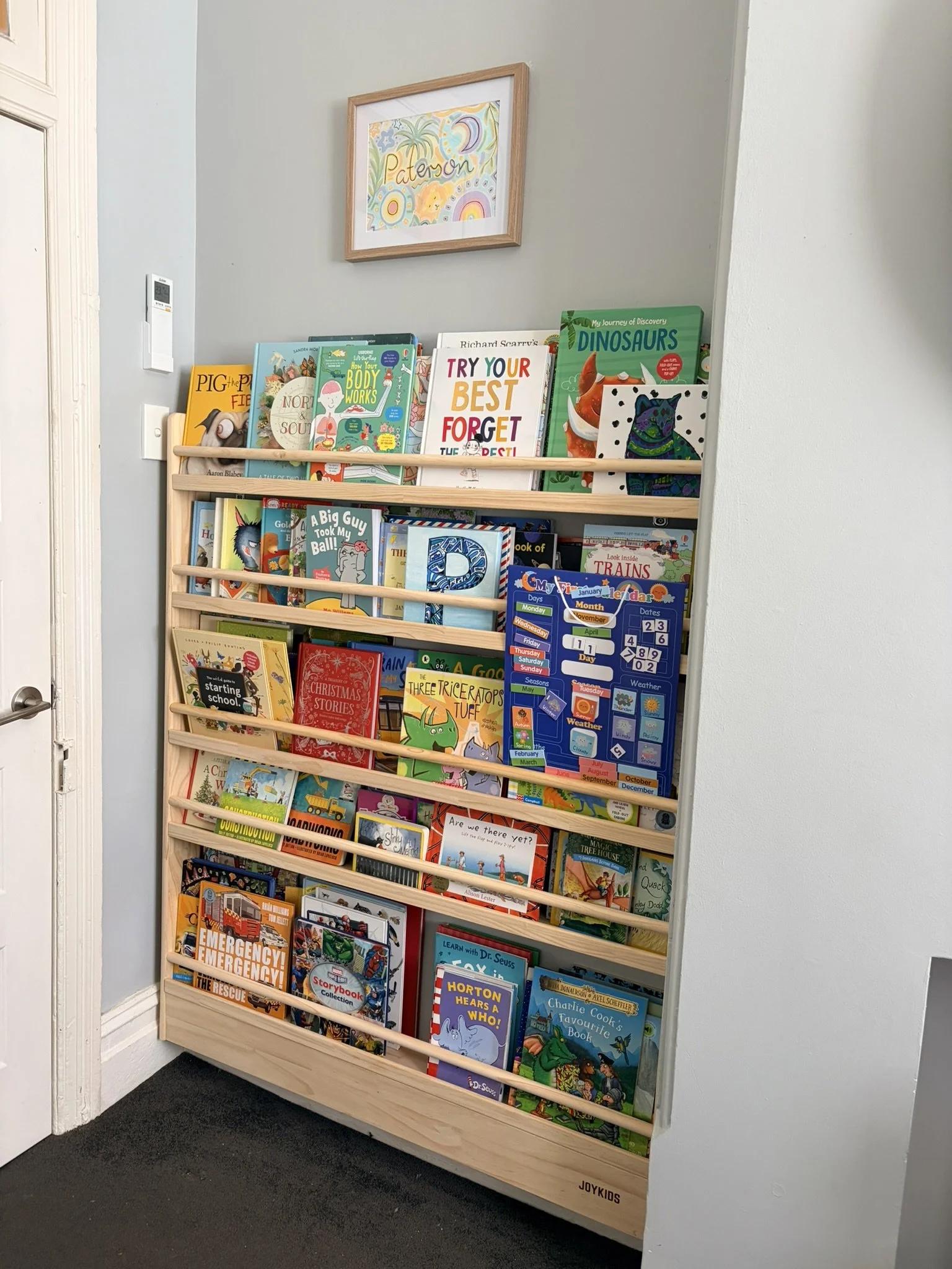 Organised boys bookcase after