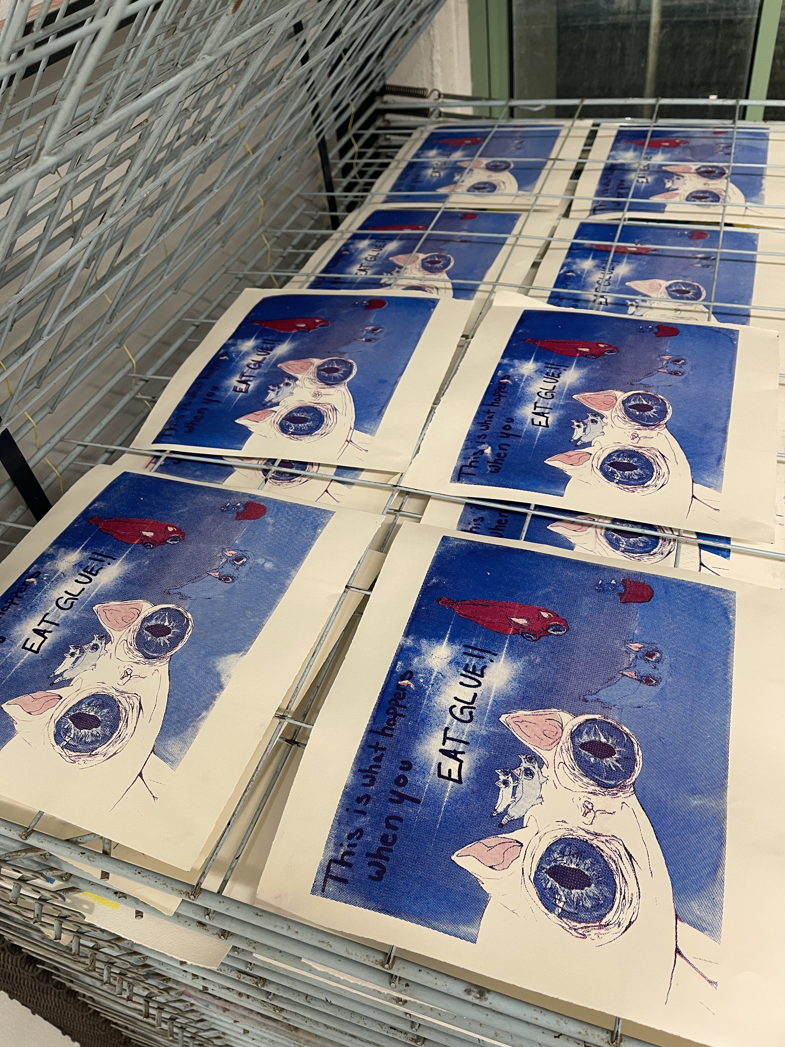 In progress shots of the Silly CMYK screen prints of banana cats that were used in a print exchange portfolio.