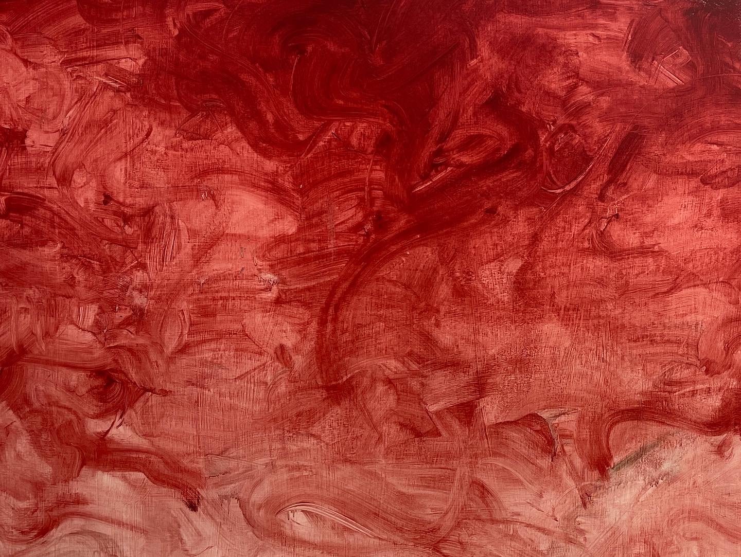 A wide large abstract bloodly smear the artist did as a background for a figure painting.