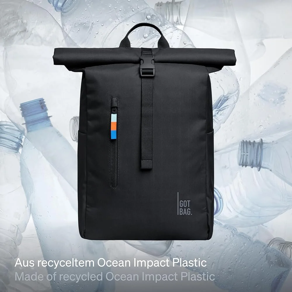 Black rolltop backpack by Got Bag with empty plastic water bottles in the background to show their sustainable design process from waste to fashion.