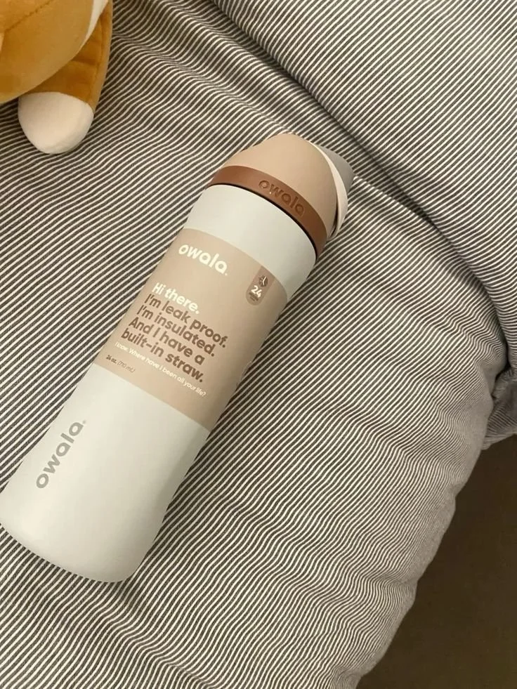 Viral Owala water bottle in soft neutrals, showcasing the consumer shift towards relaxing palettes.