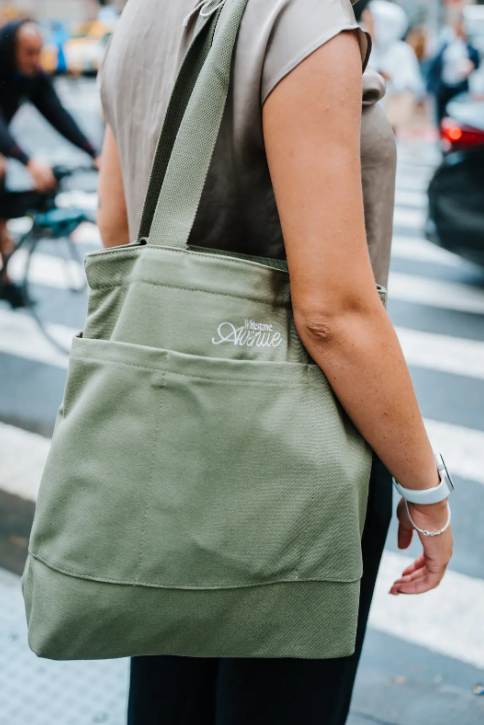 Custom branded retail bag in lifestyle context showing premium decoration and quality construction for brand merchandise