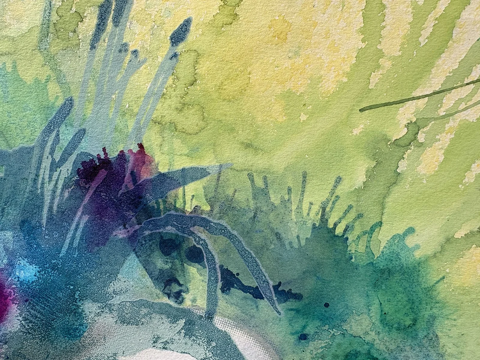 Abstract watercolor painting with shades of green, blue, purple, and hints of yellow, featuring fluid shapes and textures.