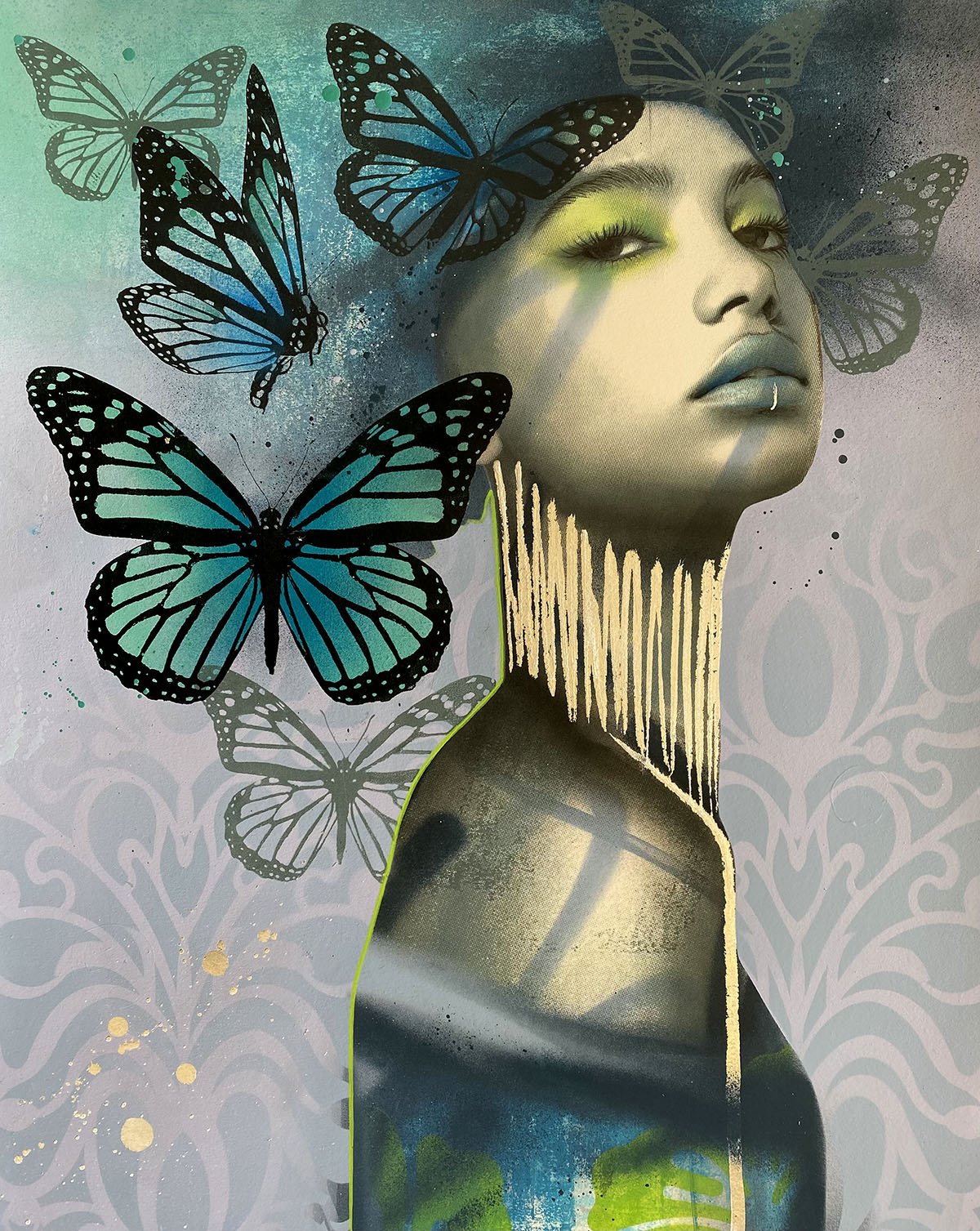 Street art mural featuring a stylized portrait of a woman with butterflies around her face, vibrant colors, and decorative background patterns.