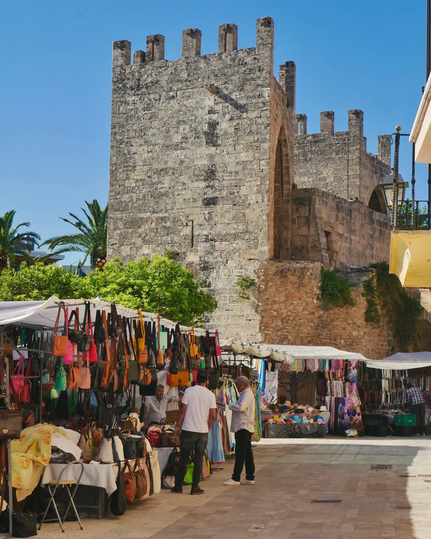 Step into the heart of Alc&uacute;dia Market, set within the historic walled town built on the site of an ancient Roman settlement.
.
As you wander through the vibrant market streets, you&rsquo;ll discover a maze of narrow lanes tucked inside Alc&uac