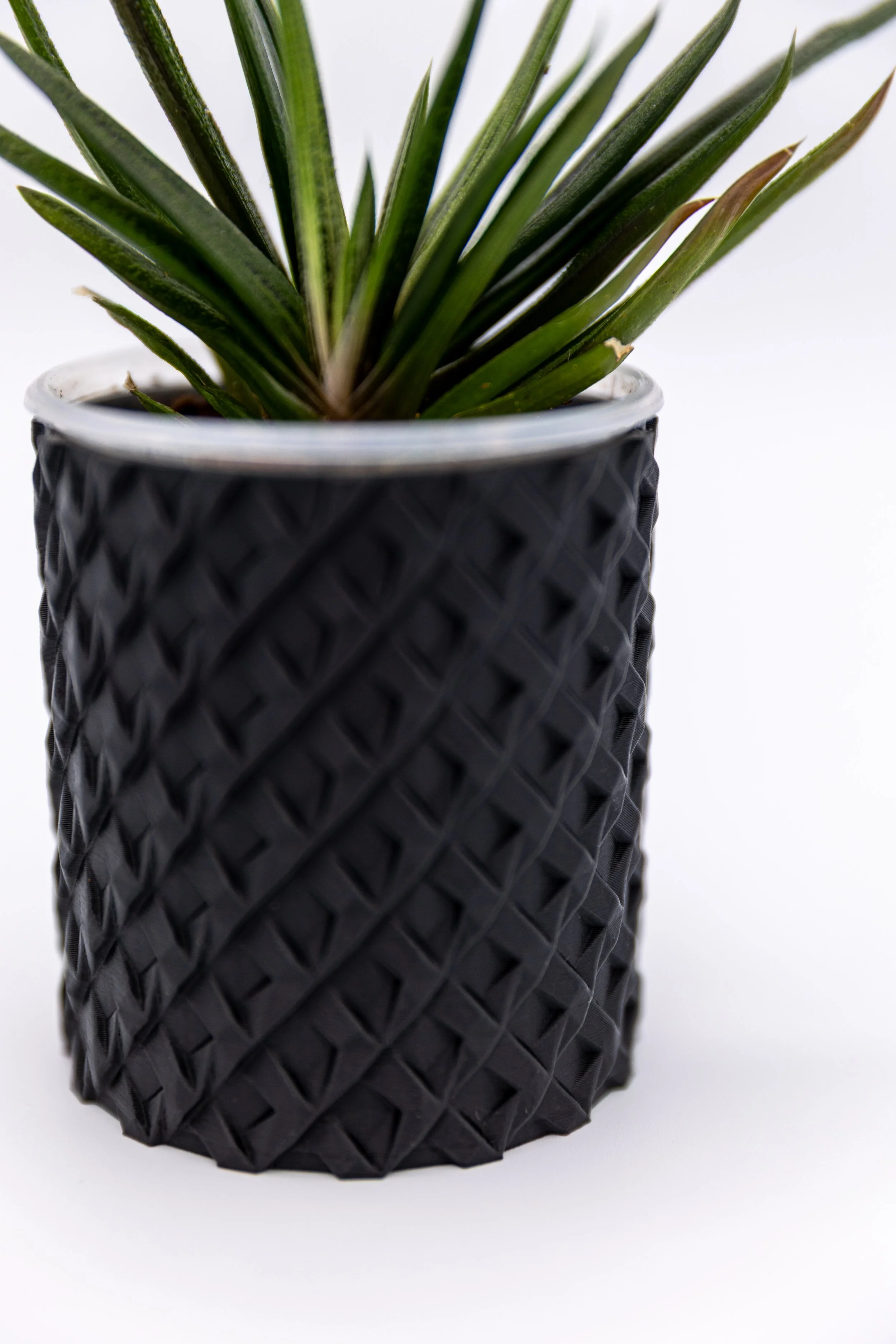 Close-up of the Kenny Planter showing the raised crosshatch texture.