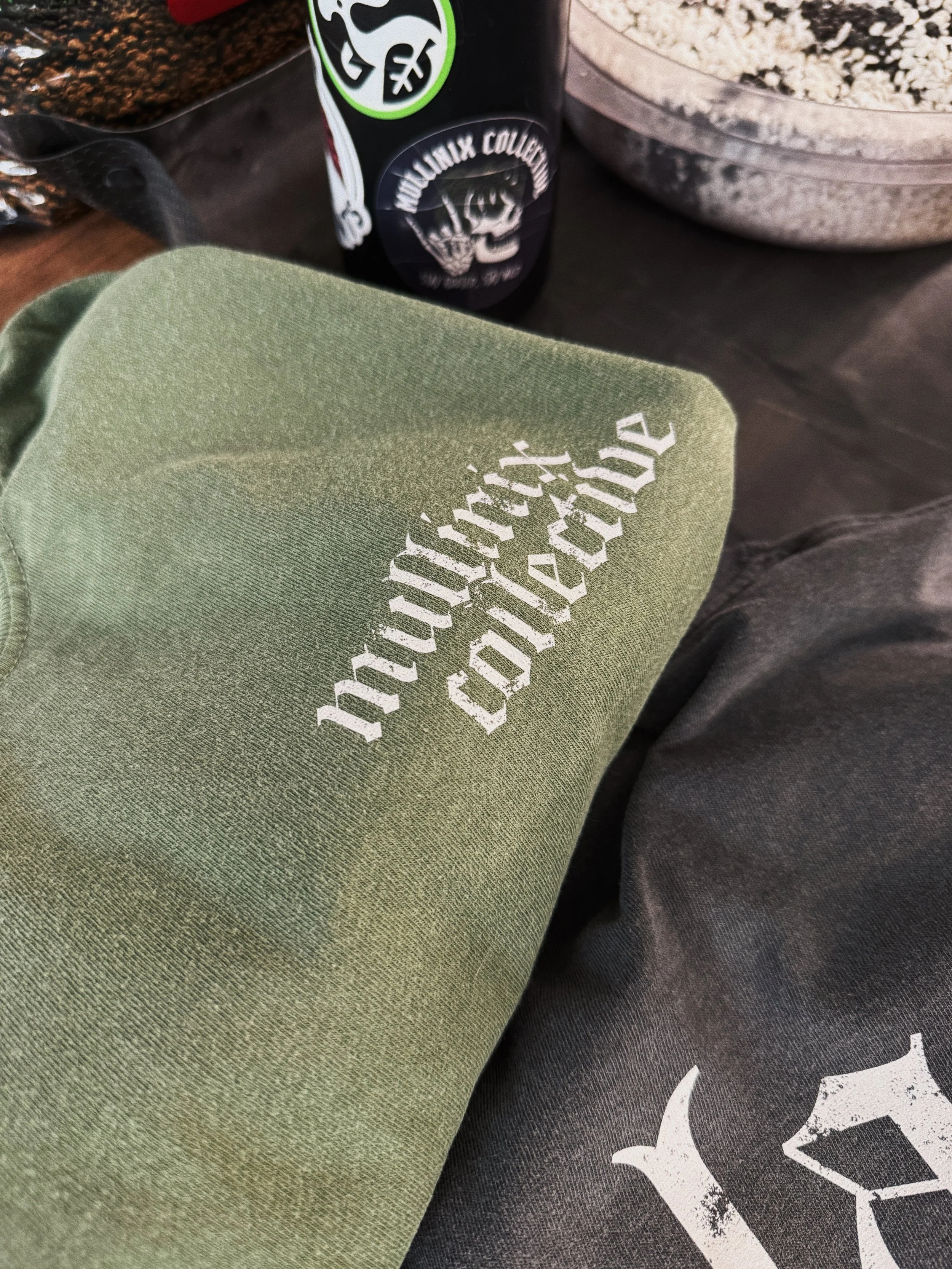 Front chest Mullinix Collective logo printed on olive green Comfort Colors plant lover t-shirt