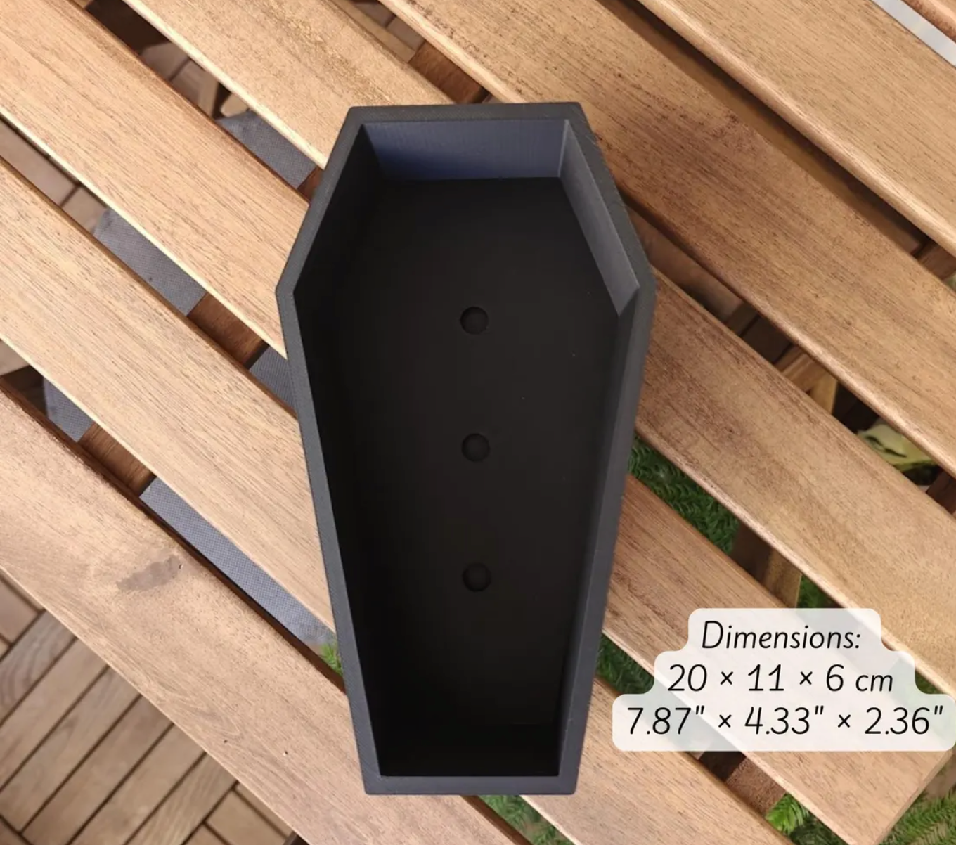 Interior of black coffin planter with three drainage holes and size callout 7.87 × 4.33 × 2.36 inches.