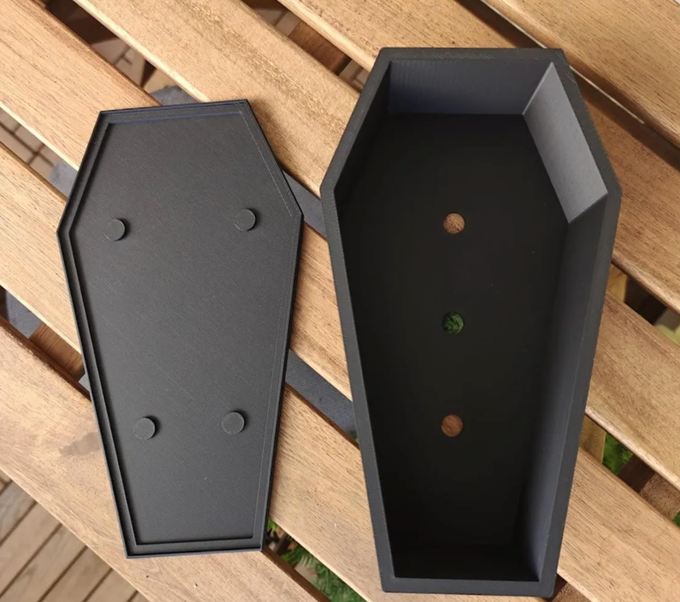 Coffin planter and separate matching drip tray; interior shows round drainage holes.