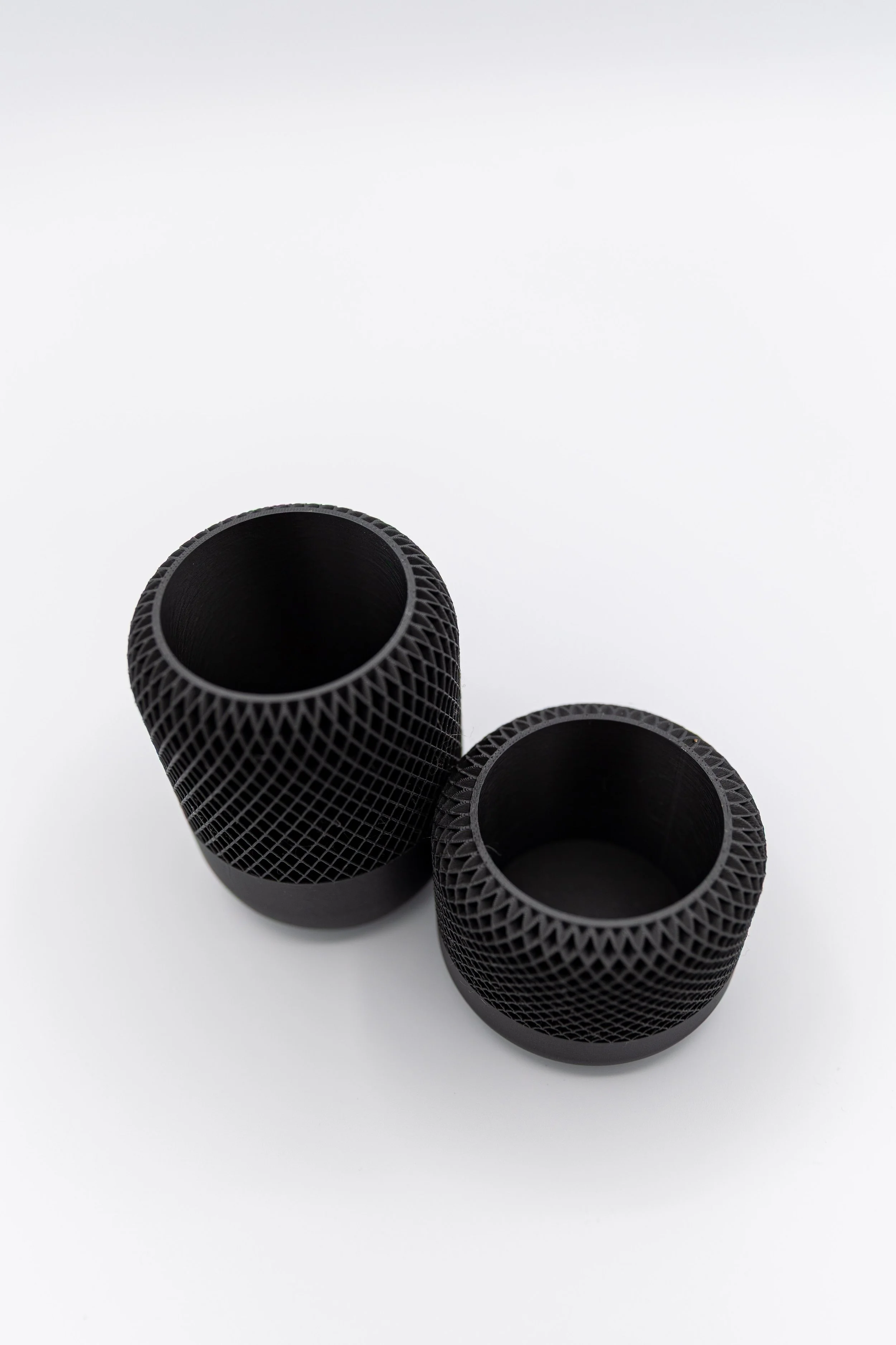 Top-down view of empty Night Drive Planters showing inner shape and mesh pattern.