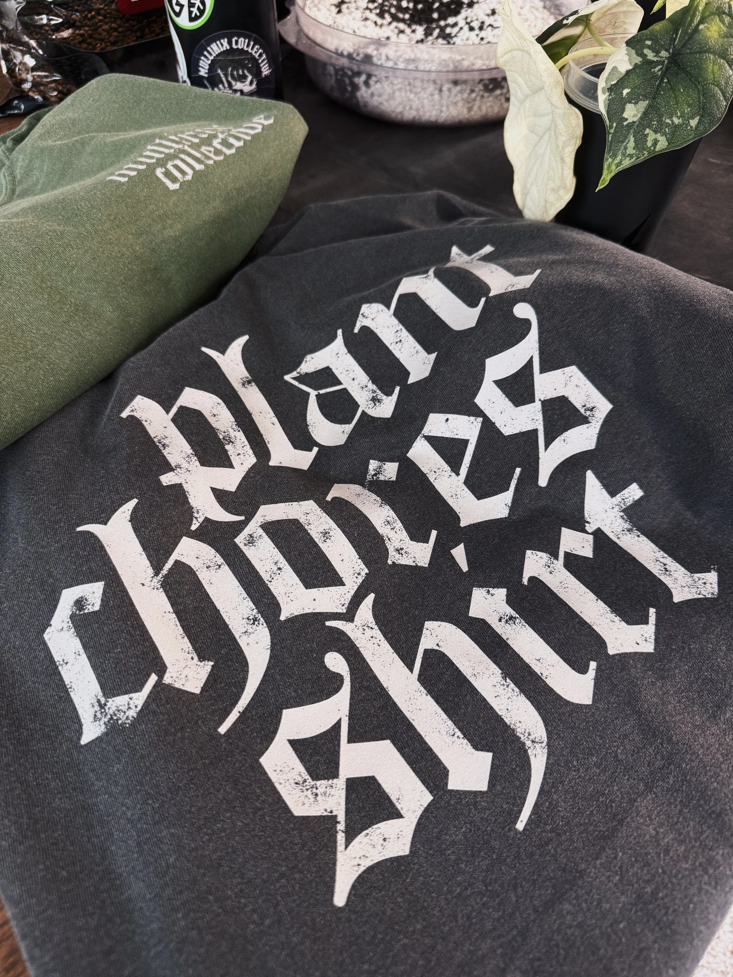 Alternative plant lover graphic tee with oversized gothic "Plant Chores Shirt" design on the back