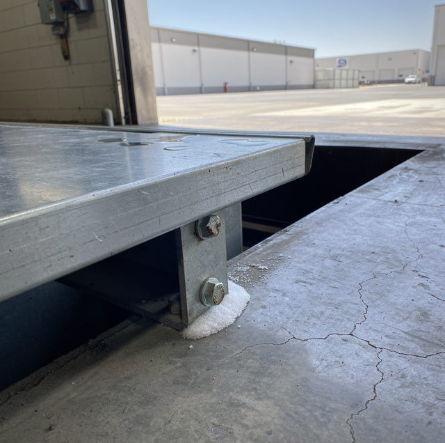 corroded dock leveler hinges with rust and pitting
