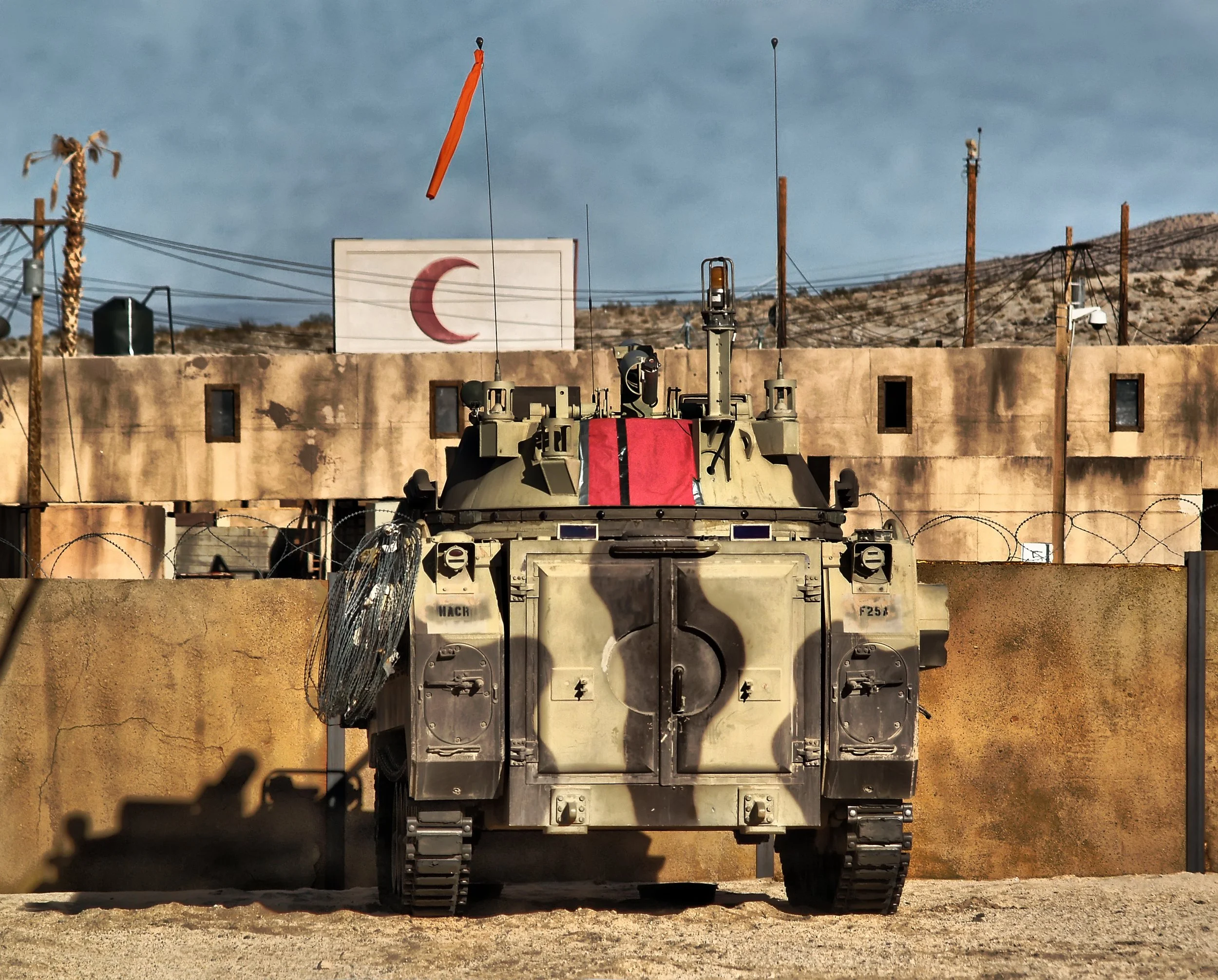 A "OSV" or  Opposing Force Surrogate Vehicle based off the M113 APC parked in Medina Wasl village in "The Box" at the National Training Center, Fort Irwin, California circa 2012. 