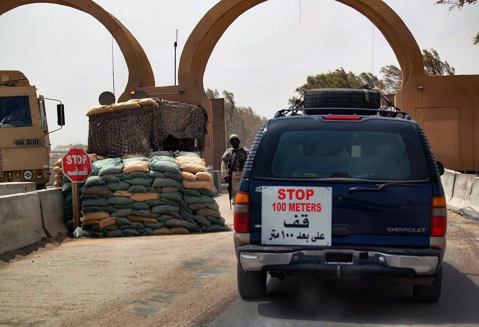 Private Military Contractors leave the gate of Camp Adder/Tallil AFB in An Nasiriyah Iraq circa 2006. 