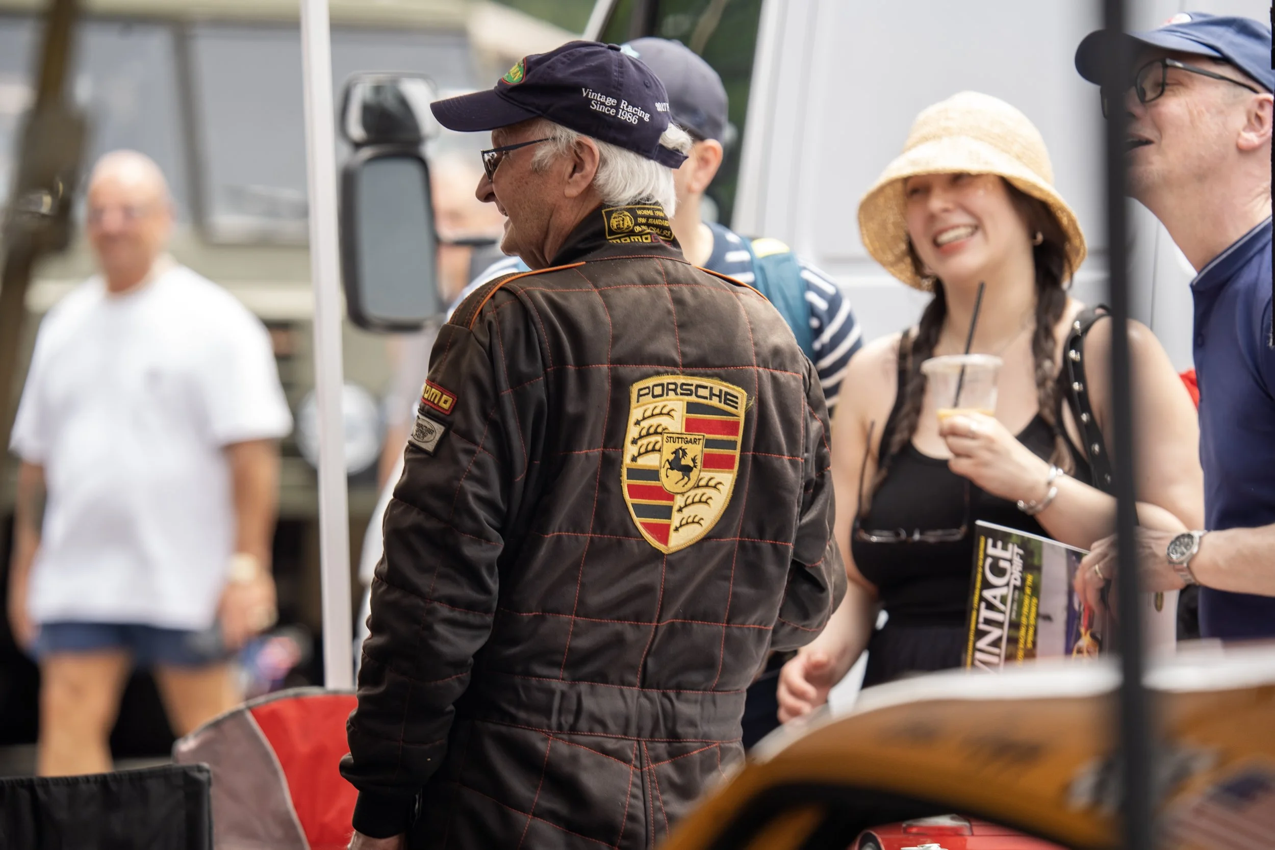 A driver wearing Porsche Branded Racing Suit at the Sovren Pacific Northwest Historics Races at the Pacific Raceways in Kent Washington, June 2024