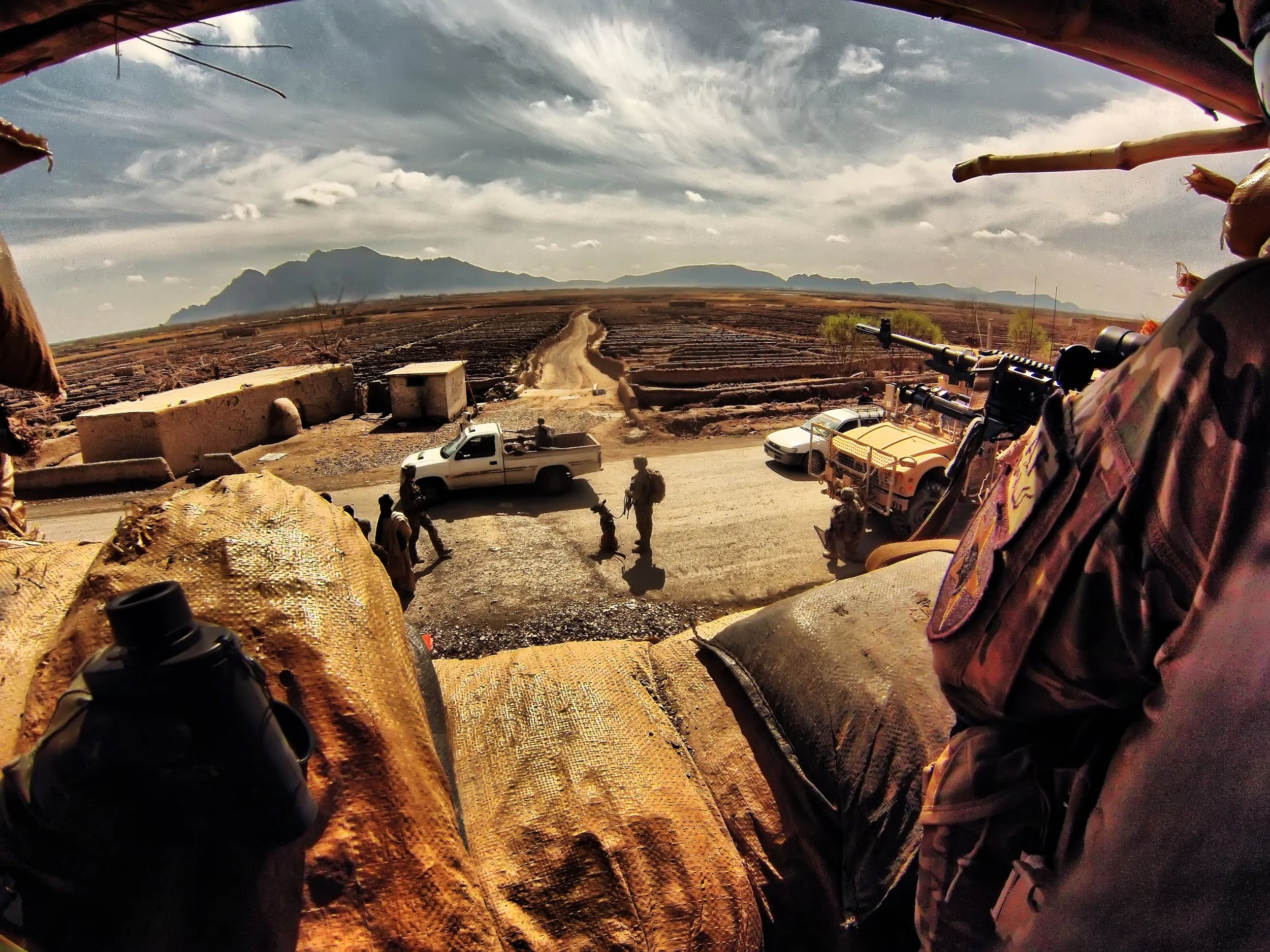 Soldiers from F. Co 52nd Infantry conduct Recon and Overwatch while other soldiers conduct a Traffic Control Point (TCP) in Panjwai Afghanista, 2013. 